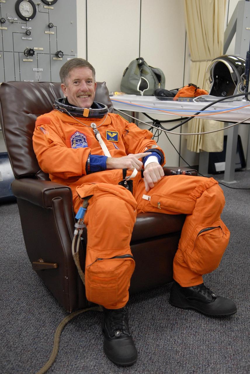 KENNEDY SPACE CENTER, FLA. -- Mission STS-117 Mission Specialist James Reilly has donned his launch suit for a fit check, part of the pre-launch preparations during terminal countdown demonstration test (TCDT) activities. The mission crew is at KSC for the TCDT, which includes a simulated launch countdown.The STS-117 mission is No. 21 to the International Space Station. Mission payloads aboard Atlantis include the S3/S4 integrated truss structure, a third set of solar arrays and batteries. The crew of six astronauts will install the truss to continue assembly of the station. Launch is scheduled for no earlier than March 15. Photo credit: NASA/Kim Shiflett.