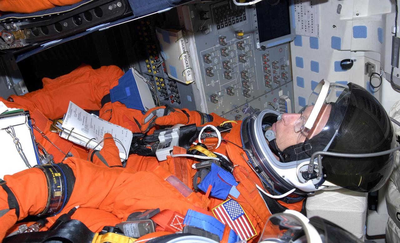 KENNEDY SPACE CENTER, FLA. --  Mission STS-117 Mission Specialist Patrick Forrester sits inside Space Shuttle Atlantis at Launch Pad 39A to participate in a simulated launch countdown that is part of the prelaunch preparations known as the terminal countdown demonstration test (TCDT).The TCDT also includes M-113 armored personnel carrier training and payload familiarization. The STS-117 mission is No. 21 to the International Space Station. Mission payloads aboard Atlantis include the S3/S4 integrated truss structure, a third set of solar arrays and batteries. The crew of six astronauts will install the truss to continue assembly of the station. Launch is scheduled for no earlier than March 15.   Photo credit: NASA/Kim Shiflett.
