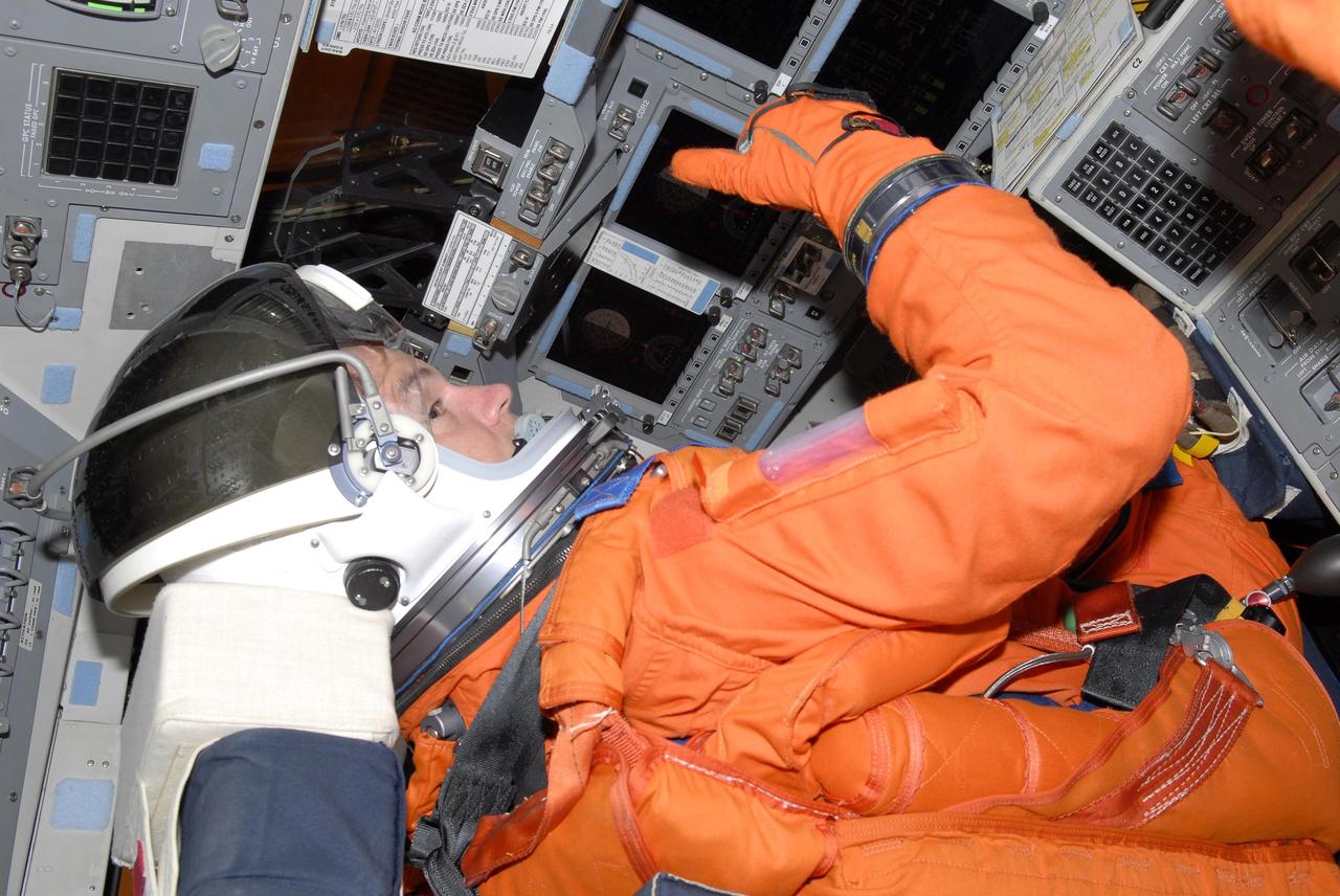 KENNEDY SPACE CENTER, FLA. --  Mission STS-117 Commander Rick Sturckow sits in the cockpit of Space Shuttle Atlantis at Launch Pad 39A to participate in a simulated launch countdown that is part of the prelaunch preparations known as terminal demonstration countdown test (TCDT). The TCDT also includes M-113 armored personnel carrier training and payload familiarization. The STS-117 mission is No. 21 to the International Space Station. Mission payloads aboard Atlantis include the S3/S4 integrated truss structure, a third set of solar arrays and batteries. The crew of six astronauts will install the truss to continue assembly of the station. Launch is scheduled for no earlier than March 15.   Photo credit: NASA/Kim Shiflett.