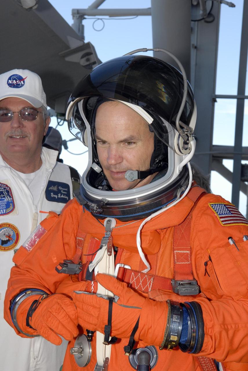 KENNEDY SPACE CENTER, FLA. -- Mission STS-117 Commander Rick Sturckow completes emergency egress procedures at the 195-foot level of the fixed service structure on Launch Pad 39A during the prelaunch preparations known as terminal countdown demonstration test (TCDT). The TCDT also includes M-113 armored personnel carrier training and payload familiarization. The STS-117 mission is No. 21 to the International Space Station. Mission payloads aboard Atlantis include the S3/S4 integrated truss structure, a third set of solar arrays and batteries. The crew of six astronauts will install the truss to continue assembly of the station. Launch is scheduled for no earlier than March 15. Photo credit: NASA/Kim Shiflett.