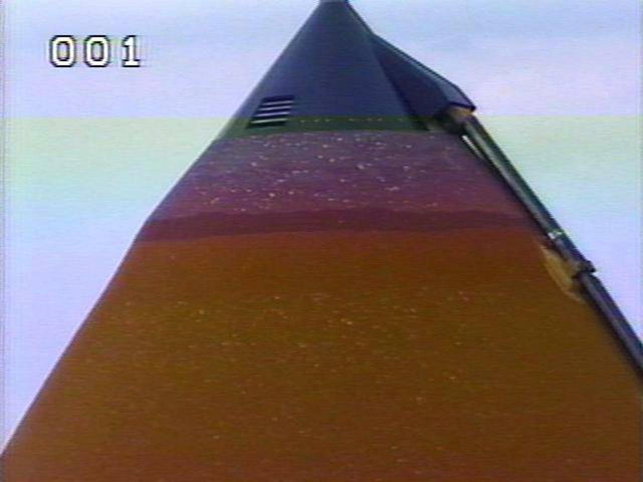 KENNEDY SPACE CENTER, FLA. --  At Launch Pad 39A, the external tank attached to Space Shuttle Atlantis shows damage from hail bombardment during a strong thunderstorm that passed through Kennedy Space Center about 5 p.m. EST on Feb. 26. A full assessment of the storm's impact is under way.  The two-day STS-117 Flight Readiness Review is being held concurrently with the assessment. Hail also impacted Space Shuttle Columbia before the launch of STS-4 in 1982; Atlantis, being readied for STS-38 in 1990; and Discovery, before the launch of STS-96 in 1999.