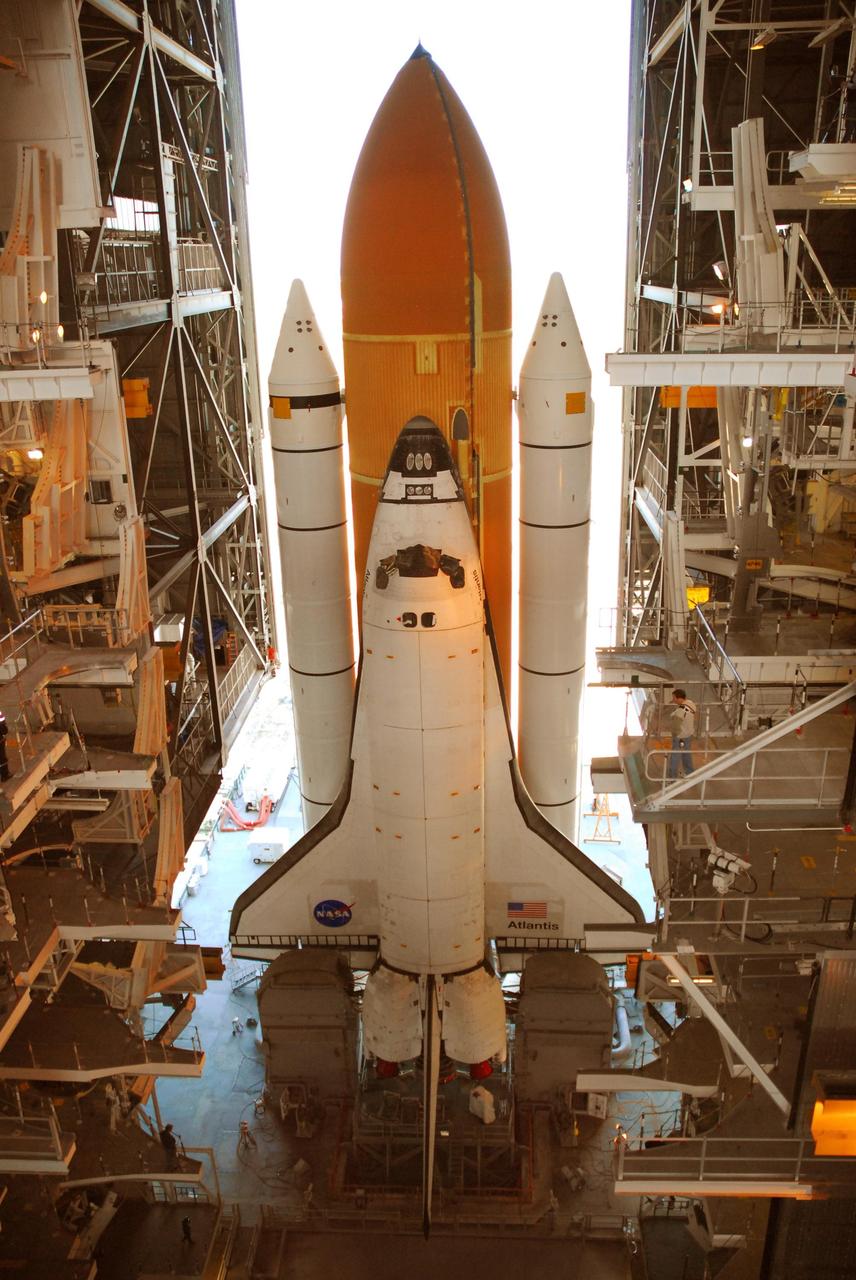 KENNEDY SPACE CENTER, FLA. --  After leaving Launch Pad 39A, Space Shuttle Atlantis, atop the mobile launcher platform, comes to rest in high bay 1 of the Vehicle Assembly Building.  A severe thunderstorm with golf ball-sized hail caused divots in the giant tank's foam insulation and minor surface damage to about 26 heat shield tiles on the shuttle's left wing. Further evaluation of the tank is necessary to get an accurate accounting of foam damage and determine the type of repair required and the time needed for that work.  A new target launch date has not been determined, but teams will focus on preparing Atlantis for liftoff in late April.  Photo credit: NASA/Amanda Diller