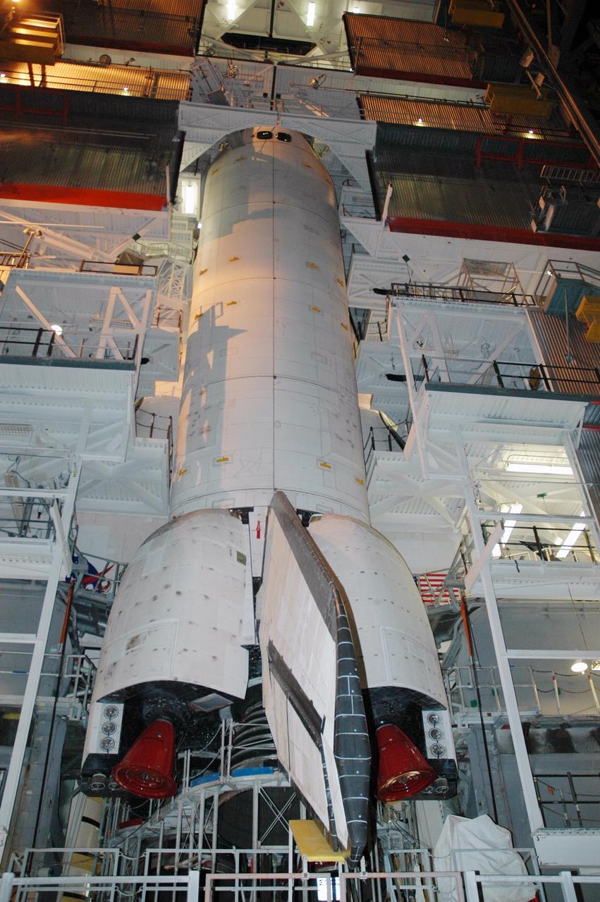 KENNEDY SPACE CENTER, FLA. --  Service platforms surround Space Shuttle Atlantis as it sits in Highbay 1 inside the Vehicle Assembly Building, while repair work continues on the external tank.  In late February, Atlantis' external tank received hail damage during a severe thunderstorm that passed through the Kennedy Space Center Launch Complex 39 area. The hail caused visible divots in the giant tank's foam insulation and minor surface damage to about 26 heat shield tiles on the shuttle's left wing. A new target launch date has not been determined, but teams will focus on preparing Atlantis for liftoff in late April on mission STS-117. Photo credit: NASA/Jack Pfaller