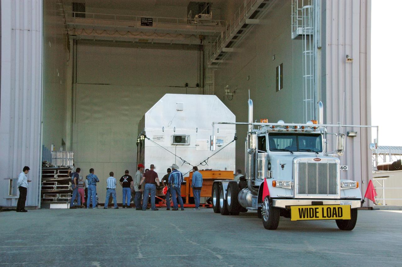 KENNEDY SPACE CENTER, FLA. --  The Experiment Logistics Module Pressurized Section for the Japanese Experiment Module arrives at the Space Station Processing Facility. The logistics module is one of the components of the Japanese Experiment Module or JEM, also known as Kibo, which means "hope" in Japanese. Kibo comprises six components: two research facilities -- the Pressurized Module and Exposed Facility; a Logistics Module attached to each of them; a Remote Manipulator System; and an Inter-Orbit Communication System unit. Kibo also has a scientific airlock through which experiments are transferred and exposed to the external environment of space. Kibo is Japan's first human space facility and its primary contribution to the station. Kibo will enhance the unique research capabilities of the orbiting complex by providing an additional environment in which astronauts can conduct science experiments. The various components of JEM will be assembled in space over the course of three Space Shuttle missions. The first of those three missions, STS-123, will carry the Experiment Logistics Module Pressurized Section aboard the Space Shuttle Endeavour, targeted for launch in 2007.  Photo credit: NASA/George Shelton