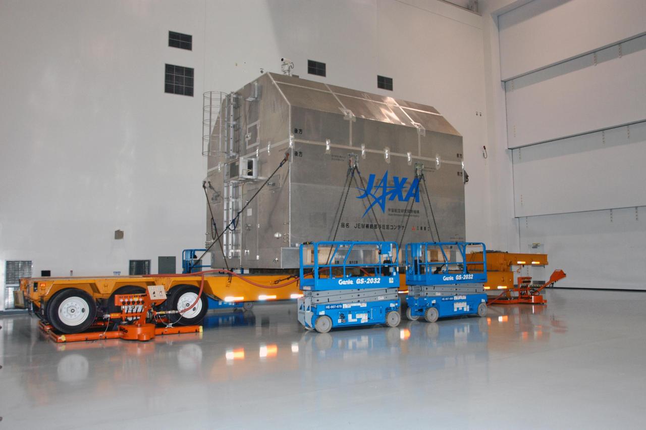 KENNEDY SPACE CENTER, FLA. --  The Experiment Logistics Module Pressurized Section for the Japanese Experiment Module arrives at the Space Station Processing Facility for uncrating. The logistics module is one of the components of the Japanese Experiment Module or JEM, also known as Kibo, which means "hope" in Japanese. Kibo comprises six components: two research facilities -- the Pressurized Module and Exposed Facility; a Logistics Module attached to each of them; a Remote Manipulator System; and an Inter-Orbit Communication System unit. Kibo also has a scientific airlock through which experiments are transferred and exposed to the external environment of space. Kibo is Japan's first human space facility and its primary contribution to the station. Kibo will enhance the unique research capabilities of the orbiting complex by providing an additional environment in which astronauts can conduct science experiments. The various components of JEM will be assembled in space over the course of three Space Shuttle missions. The first of those three missions, STS-123, will carry the Experiment Logistics Module Pressurized Section aboard the Space Shuttle Endeavour, targeted for launch in 2007. Photo credit: NASA/George Shelton