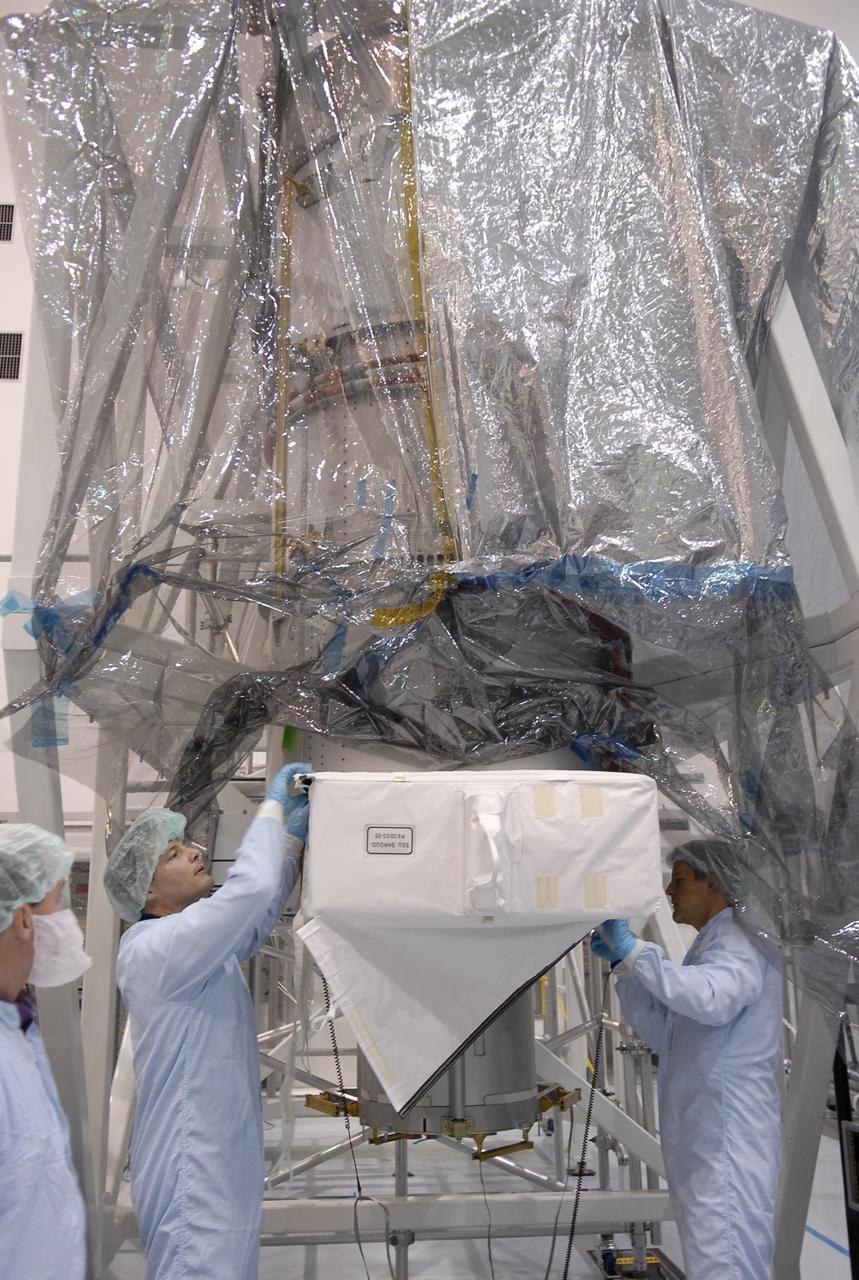 KENNEDY SPACE CENTER, FLA. --  Mission STS-120 Mission Specialists Douglas Wheelock (left) and Scott Parazynski familiarize themselves with equipment inside the Space Station Processing Facility during a visit to Kennedy Space Center. Other crew members include Commander Pam Melroy, Pilot George Zamka and Mission Specialists Stephanie Wilson, Paolo Nespoli (with the European Space Agency), Daniel Tani and Clayton Anderson. Mission STS-120 will deliver the Node 2 "Harmony" connecting module to the station.  During the mission, Tani and Anderson will transfer to the station and remain as flight engineers for Expedition 15. The mission is tentatively scheduled for August of this year. Photo credit: NASA/Kim Shiflett