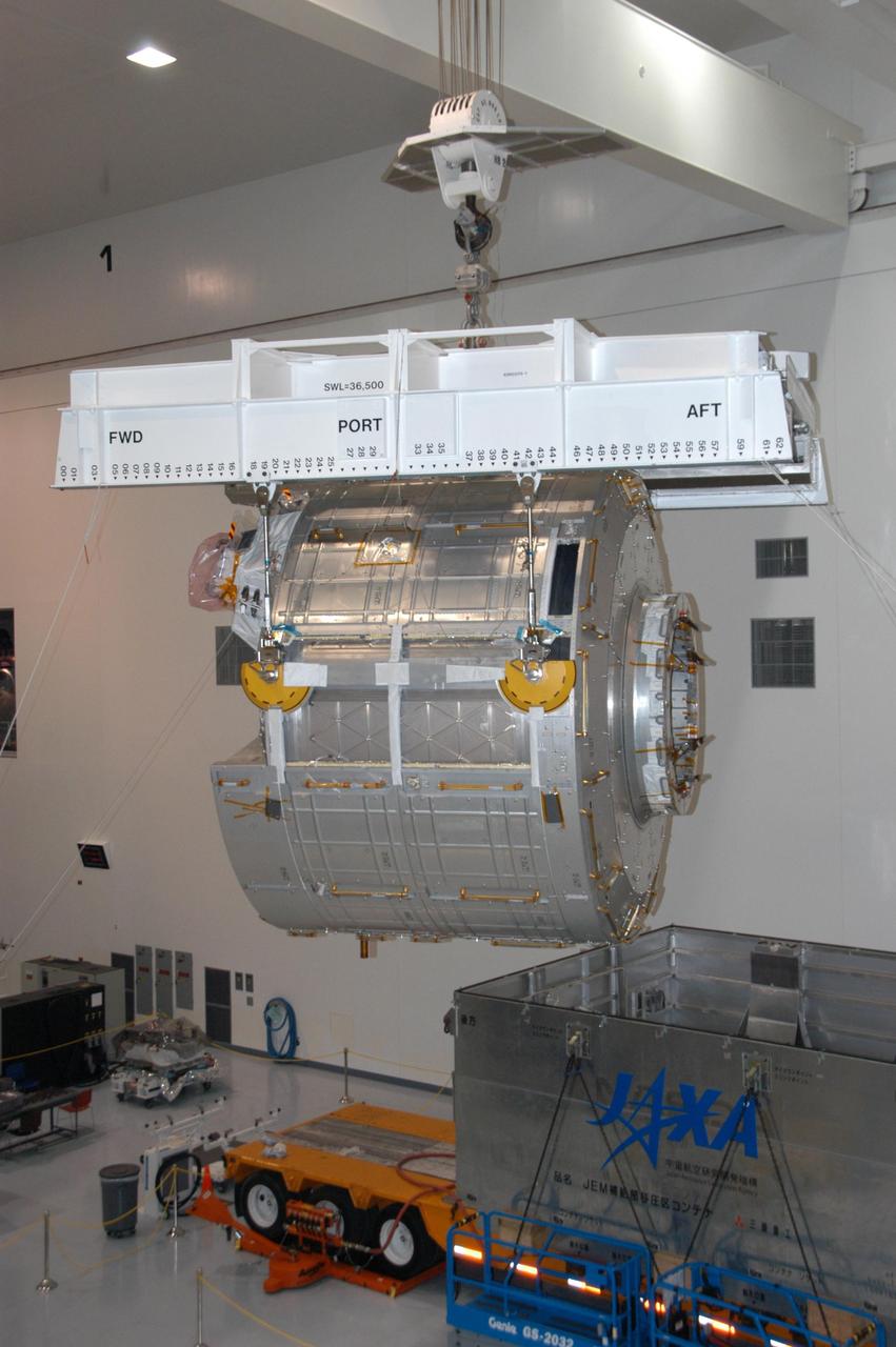 KENNEDY SPACE CENTER, FLA. -- In the Space Station Processing Facility, an overhead crane lifts the JEM Experiment Logistics Module Pressurized Section from its shipping container and moves it toward a scale for weight and center-of-gravity measurements. The module will then be moved to a work stand. The logistics module is one of the components of the Japanese Experiment Module or JEM, also known as Kibo, which means "hope" in Japanese. Kibo comprises six components: two research facilities -- the Pressurized Module and Exposed Facility; a Logistics Module attached to each of them; a Remote Manipulator System; and an Inter-Orbit Communication System unit. Kibo also has a scientific airlock through which experiments are transferred and exposed to the external environment of space. Kibo is Japan's first human space facility and its primary contribution to the station. Kibo will enhance the unique research capabilities of the orbiting complex by providing an additional environment in which astronauts can conduct science experiments. The various components of JEM will be assembled in space over the course of three Space Shuttle missions. The first of those three missions, STS-123, will carry the Experiment Logistics Module Pressurized Section aboard the Space Shuttle Endeavour, targeted for launch in 2007. Photo credit: NASA/George Shelton