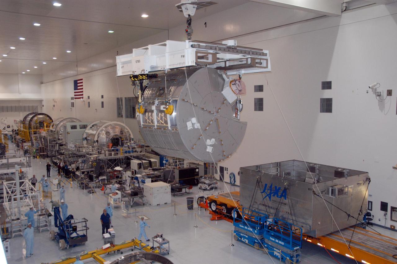 KENNEDY SPACE CENTER, FLA. -- An overhead crane moves the JEM Experiment Logistics Module Pressurized Section above the floor of the Space Station Processing Facility to a scale for weight and center-of-gravity measurements. The module will then be moved to a work stand. The logistics module is one of the components of the Japanese Experiment Module or JEM, also known as Kibo, which means "hope" in Japanese. Kibo comprises six components: two research facilities -- the Pressurized Module and Exposed Facility; a Logistics Module attached to each of them; a Remote Manipulator System; and an Inter-Orbit Communication System unit. Kibo also has a scientific airlock through which experiments are transferred and exposed to the external environment of space. Kibo is Japan's first human space facility and its primary contribution to the station. Kibo will enhance the unique research capabilities of the orbiting complex by providing an additional environment in which astronauts can conduct science experiments. The various components of JEM will be assembled in space over the course of three Space Shuttle missions. The first of those three missions, STS-123, will carry the Experiment Logistics Module Pressurized Section aboard the Space Shuttle Endeavour, targeted for launch in 2007. Photo credit: NASA/George Shelton