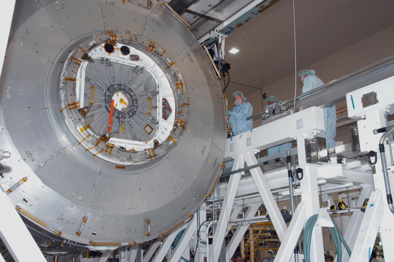 KENNEDY SPACE CENTER, FLA. -- In the Space Station Processing Facility, the JEM Experiment Logistics Module Pressurized Section is lowered onto a scale for weight and center-of-gravity measurements. The module will then be moved to a work stand. The logistics module is one of the components of the Japanese Experiment Module or JEM, also known as Kibo, which means "hope" in Japanese. Kibo comprises six components: two research facilities -- the Pressurized Module and Exposed Facility; a Logistics Module attached to each of them; a Remote Manipulator System; and an Inter-Orbit Communication System unit. Kibo also has a scientific airlock through which experiments are transferred and exposed to the external environment of space. Kibo is Japan's first human space facility and its primary contribution to the station. Kibo will enhance the unique research capabilities of the orbiting complex by providing an additional environment in which astronauts can conduct science experiments. The various components of JEM will be assembled in space over the course of three Space Shuttle missions. The first of those three missions, STS-123, will carry the Experiment Logistics Module Pressurized Section aboard the Space Shuttle Endeavour, targeted for launch in 2007. Photo credit: NASA/George Shelton