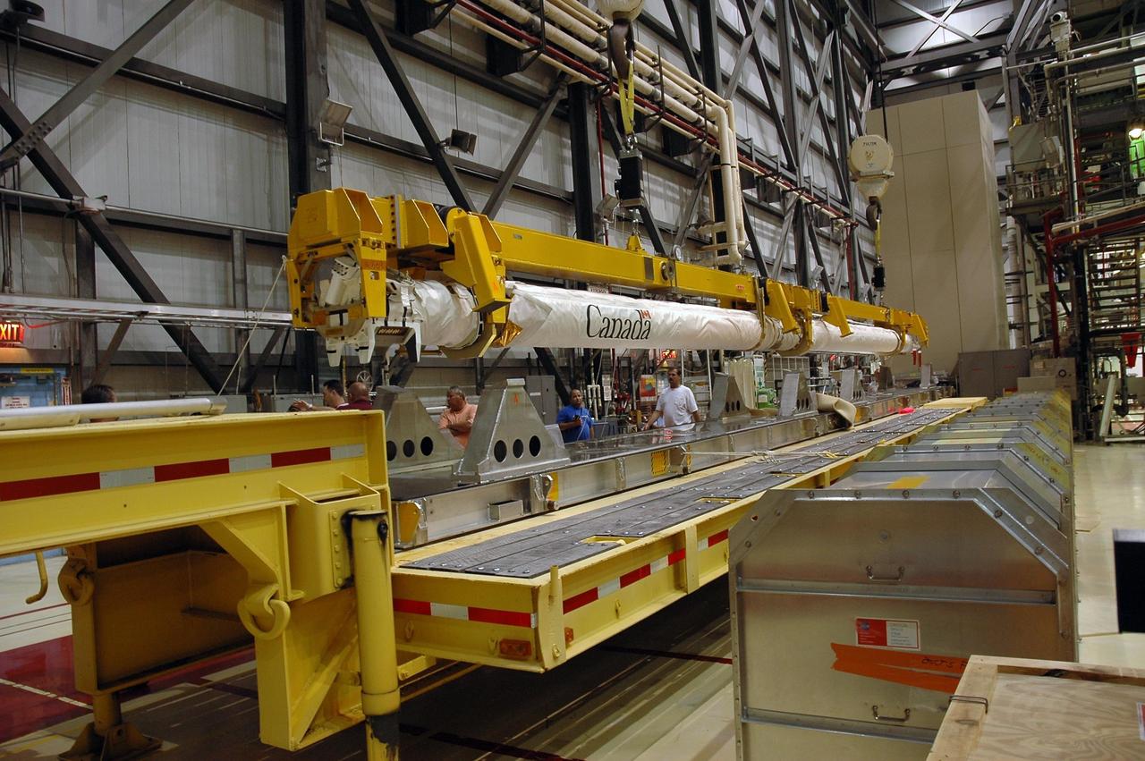 KENNEDY SPACE CENTER, FLA.  --  In Orbiter Processing Facility bay 2, the orbiter boom sensor system is lifted from its stand for installation in Endeavour.  The orbiter is scheduled to fly on mission STS-118 to the International Space Station in the summer of 2007.  It will deliver the third starboard truss segment, S5.  Photo credit: NASA/Troy Cryder