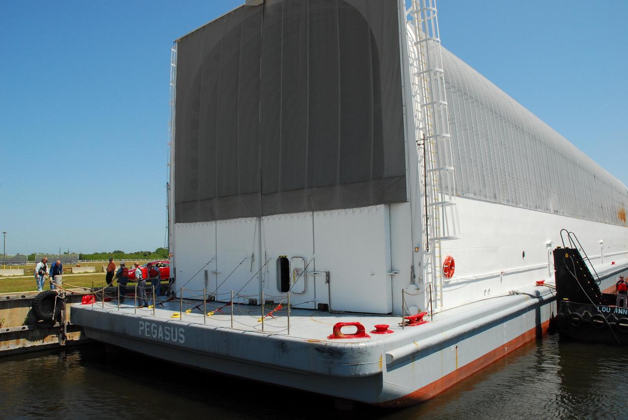 KENNEDY SPACE CENTER, FLA.  --  The Pegasus barge is tied up at the dock in the turn basin of the Launch Complex 39 Area.  The barge's cargo is the external tank prepared for mission STS-118 by the Michoud Assembly Facility near New Orleans.  The tank will later be offloaded and moved to the Vehicle Assembly Building.  Photo credit: Jack Pfaller