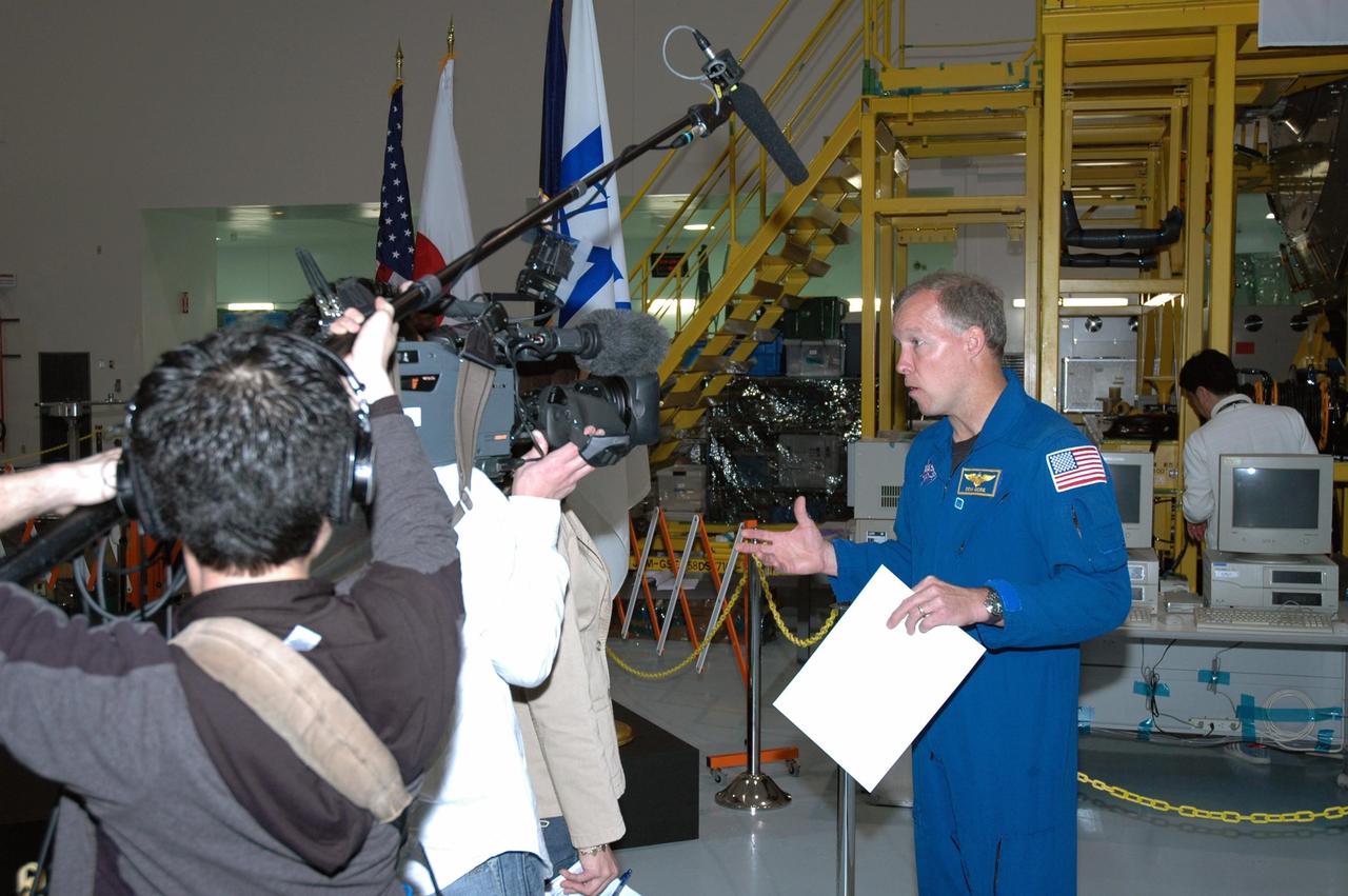 KENNEDY SPACE CENTER, FLA.  --  After a welcoming ceremony for the Experiment Logistics Module Pressurized Section of the Japanese Experiment Module, STS-123 Commander Dominic Gorie talks to the media.  Earlier, NASA and Japanese Space Agency (JAXA) officials welcomed the arrival of the logistics module, which will be delivered to the space station on mission STS-123. The module will serve as an on-orbit storage area for materials, tools and supplies. It can hold up to eight experiment racks and will attach to the top of another larger pressurized module.  Photo credit: NASA/George Shelton