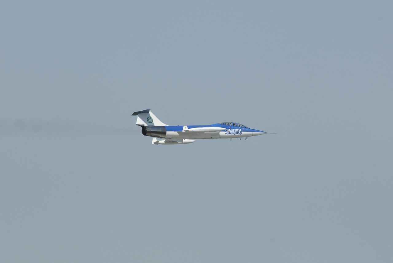 KENNEDY SPACE CENTER, FLA.  --   The Starfighter F-104 is airborne after taking off from the KSC Shuttle Landing Facility.  The pilot is Rick Svetkoff; the co-pilot is Dave Waldrop. The aircraft is taking part in a series of pathfinder test missions from the space shuttle runway. Two flights will generate test data to validate sonic boom assumptions about the potential impacts of suborbital and orbital commercial spaceflight from the facility. NASA is assessing the environmental impact of such flights.  Starfighters Inc. of Clearwater, Fla., will perform the flights to help in assessing suborbital space launch trajectories from the runway and paving the way for future commercial space tourism and research flights from the facility.  Photo credit: NASA/Kim Shiflett