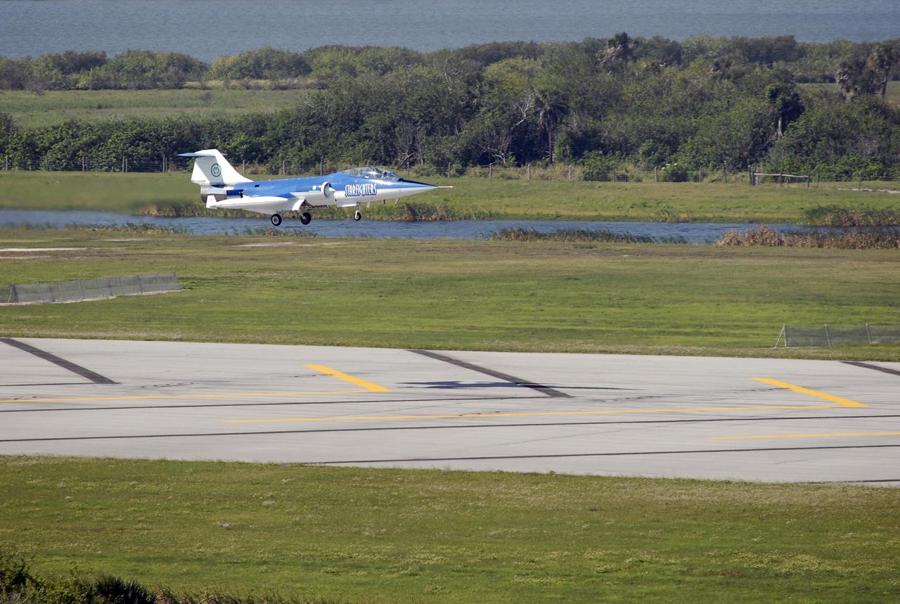 KENNEDY SPACE CENTER, FLA.  --   The Starfighter F-104 approaches the runway at the KSC Shuttle Landing Facility for a landing after its test flight. The aircraft is taking part in a series of pathfinder test missions from the space shuttle runway. Two flights will generate test data to validate sonic boom assumptions about the potential impacts of suborbital and orbital commercial spaceflight from the facility. NASA is assessing the environmental impact of such flights.  Starfighters Inc. of Clearwater, Fla., will perform the flights to help in assessing suborbital space launch trajectories from the runway and paving the way for future commercial space tourism and research flights from the facility.  Photo credit: NASA/Kim Shiflett