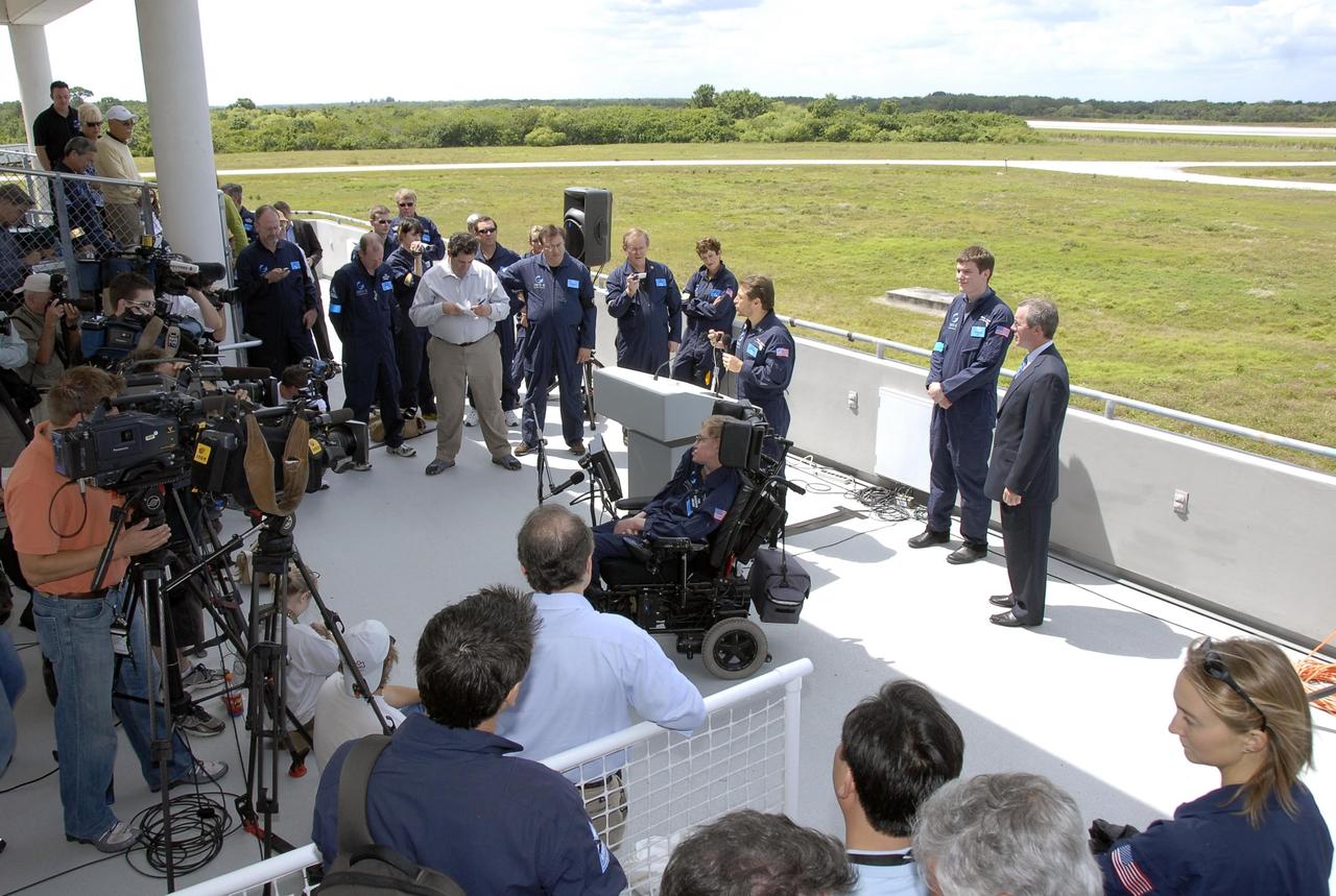KENNEDY SPACE CENTER, FLA. -- At the Kennedy Space Center Shuttle Landing Facility, Peter Diamandis, founder of the Zero Gravity Corp., talks to the media about physicist Stephen Hawking's (in the wheelchair) first zero-gravity flight. The flight will be aboard a modified Boeing 727 aircraft owned by Zero Gravity Corp., a commercial company licensed to provide the public with weightless flight experiences.  Hawking developed amyotrophic lateral sclerosis disease in the 1960s, a type of motor neuron disease which would cost him the loss of almost all neuromuscular control. At the celebration of his 65th birthday on January 8 this year, Hawking announced his plans for a zero-gravity flight to prepare for a sub-orbital space flight in 2009 on Virgin Galactic's space service.  Photo credit: NASA/Kim Shiflett
