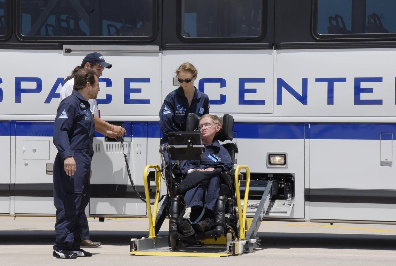 KENNEDY SPACE CENTER, FLA. -- At the Kennedy Space Center Shuttle Landing Facility, noted physicist Stephen Hawking, in the wheelchair, arrives at the runway for his first zero-gravity flight. The flight will be aboard a modified Boeing 727 aircraft owned by Zero Gravity Corp., a commercial company licensed to provide the public with weightless flight experiences.  At left is Peter Diamandis, founder of the Zero Gravity Corp. Behind Hawking is Nicola O'Brien, a nurse practitioner who is Hawking's aide.   Hawking developed amyotrophic lateral sclerosis disease in the 1960s, a type of motor neuron disease which would cost him the loss of almost all neuromuscular control. At the celebration of his 65th birthday on January 8 this year, Hawking announced his plans for a zero-gravity flight to prepare for a sub-orbital space flight in 2009 on Virgin Galactic's space service.  Photo credit: NASA/Kim Shiflett