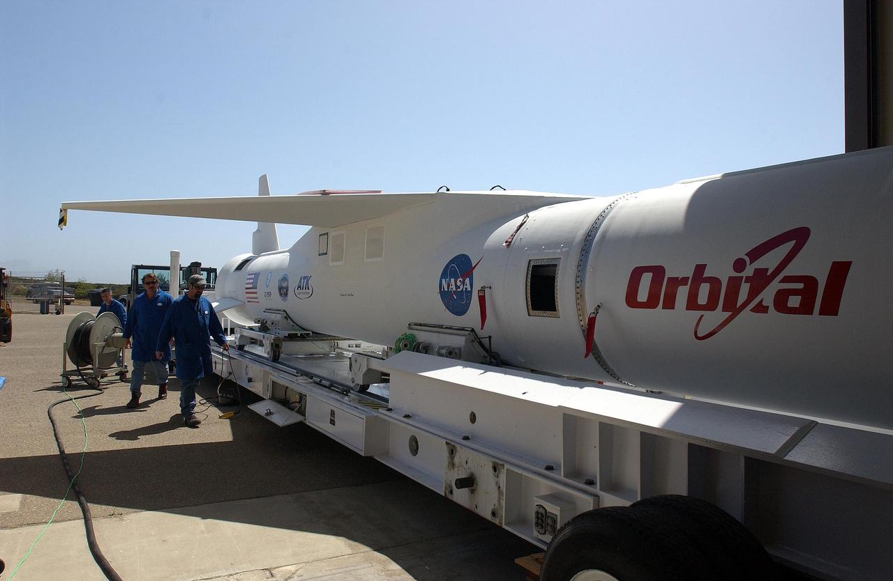 KENNEDY SPACE CENTER, FLA. --  The mated Pegasus XL rocket - AIM spacecraft is secured onto a transporter at Vandenberg Air Force Base in California.  The rocket will be transferred to a waiting Orbital Sciences Stargazer L-1011 aircraft for launch.  AIM, which stands for Aeronomy of Ice in the Mesosphere, is being prepared for integrated testing and a flight simulation.  The AIM spacecraft will fly three instruments designed to study polar mesospheric clouds located at the edge of space, 50 miles above the Earth's surface in the coldest part of the planet's atmosphere. The mission's primary goal is to explain why these clouds form and what has caused them to become brighter and more numerous and appear at lower latitudes in recent years. AIM's results will provide the basis for the study of long-term variability in the mesospheric climate and its relationship to global climate change. Launch is scheduled for April 25.