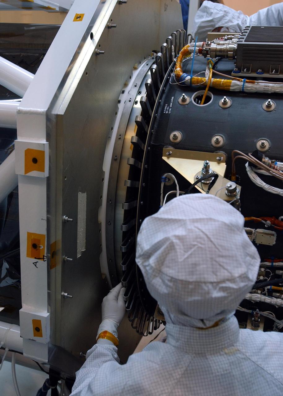 KENNEDY SPACE CENTER, FLA. -- At Vandenberg Air Force Base in California, a technician mates the AIM spacecraft, at left, to the Orbital Sciences Pegasus XL rocket, at right.  AIM, which stands for Aeronomy of Ice in the Mesosphere, is being prepared for integrated testing and a flight simulation.  The AIM spacecraft will fly three instruments designed to study polar mesospheric clouds located at the edge of space, 50 miles above the Earth's surface in the coldest part of the planet's atmosphere. The mission's primary goal is to explain why these clouds form and what has caused them to become brighter and more numerous and appear at lower latitudes in recent years. AIM's results will provide the basis for the study of long-term variability in the mesospheric climate and its relationship to global climate change.  Launch from the Pegasus XL rocket is scheduled for April 25.
