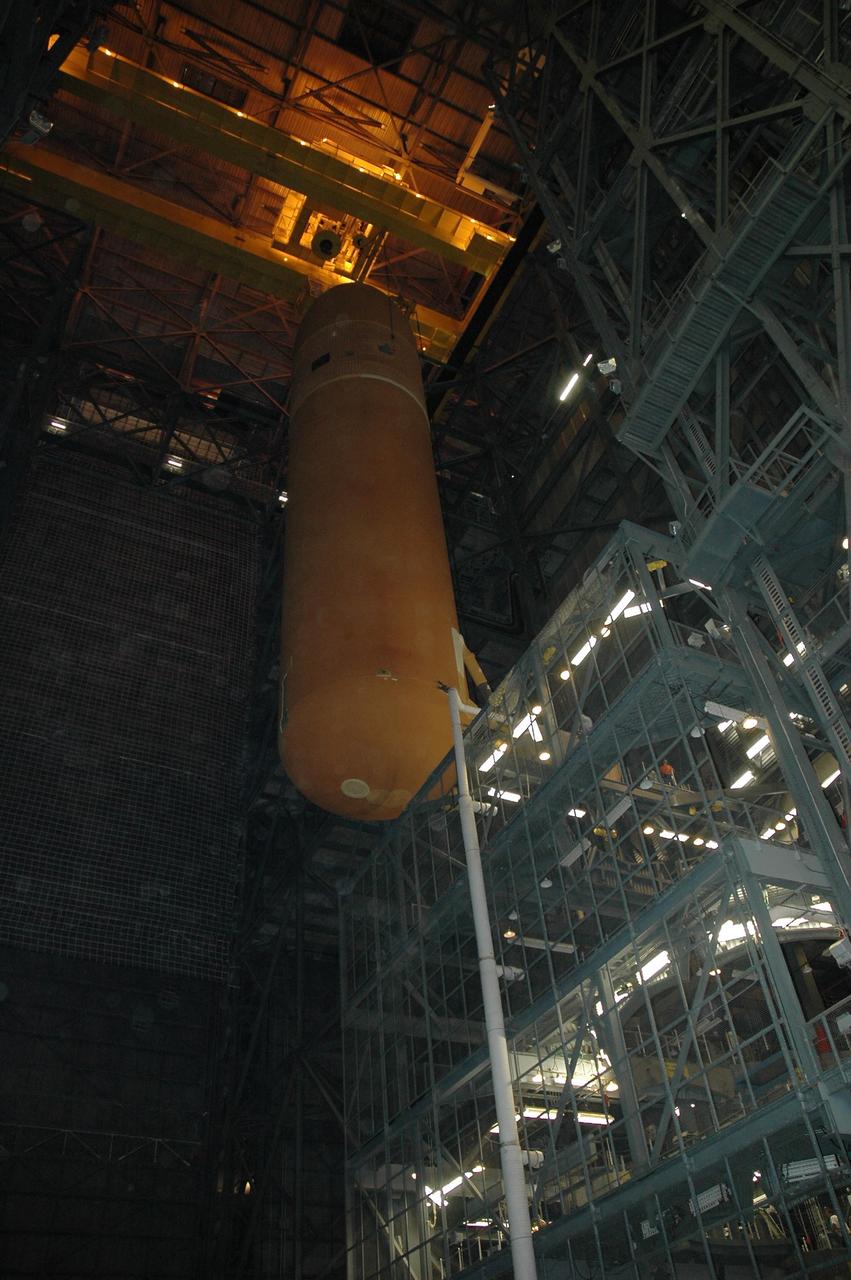 KENNEDY SPACE CENTER, FLA. -- In the Vehicle Assembly Building, the suspended external tank No. 117 moves laterally at the highest level over a crossbeam into the checkout cell in high bay 2 for processing. ET-117 arrived aboard the Pegasus barge after its voyage around the Florida Peninsula from the Michoud Assembly Facility near New Orleans. The tank is slated for mission STS-118, which is targeted for launch in early August. Photo credit: NASA/Jack Pfaller