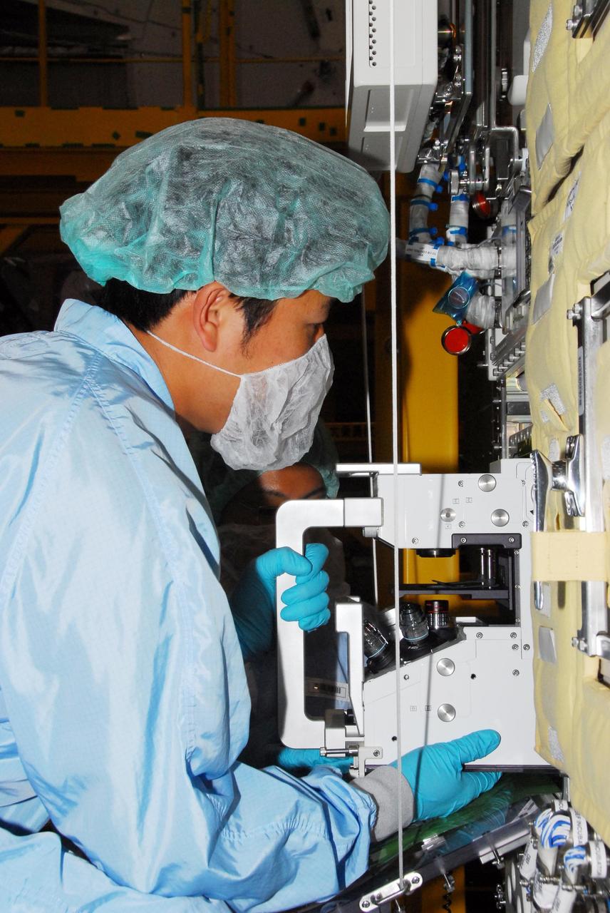 KENNEDY SPACE CENTER, FLA. --  During a bench review in the Space Station Processing Facility, astronaut Koicki Wakata gets hands-on experience on hardware he will be using in orbit.  Wakata, with the Japanese Aerospace and Exploration Agency, will join the Expedition 18 crew in 2008, flying on mission STS-126.  Photo credit: NASA/George Shelton