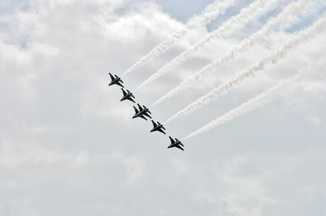 KENNEDY SPACE CENTER, FLA. -- U.S. Air Force Thunderbird F-16 jets fly in formation above the Industrial Area of Kennedy Space Center.  The purpose of the flyover was to photograph the area for promotional purposes. Kennedy Space Center Visitor Complex will host the inaugural World Space Expo from Nov. 3 to 11, featuring an aerial salute by the Thunderbirds on its opening weekend. The Expo will create one of the largest displays of space artifacts, hardware and personalities ever assembled in one location with the objective to inspire, educate and engage the public by highlighting the achievements and benefits of space exploration. Photo credit: NASA/Jack Pfaller
