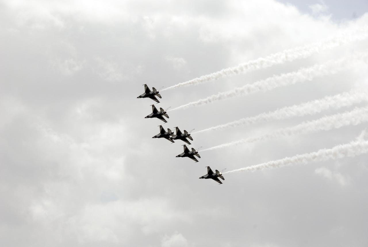 KENNEDY SPACE CENTER, FLA. -- U.S. Air Force Thunderbird F-16 jets fly in formation above the Industrial Area of Kennedy Space Center.  The purpose of the flyover was to photograph the area for promotional purposes. Kennedy Space Center Visitor Complex will host the inaugural World Space Expo from Nov. 3 to 11, featuring an aerial salute by the Thunderbirds on its opening weekend. The Expo will create one of the largest displays of space artifacts, hardware and personalities ever assembled in one location with the objective to inspire, educate and engage the public by highlighting the achievements and benefits of space exploration. Photo credit: NASA/Kim Shiflett