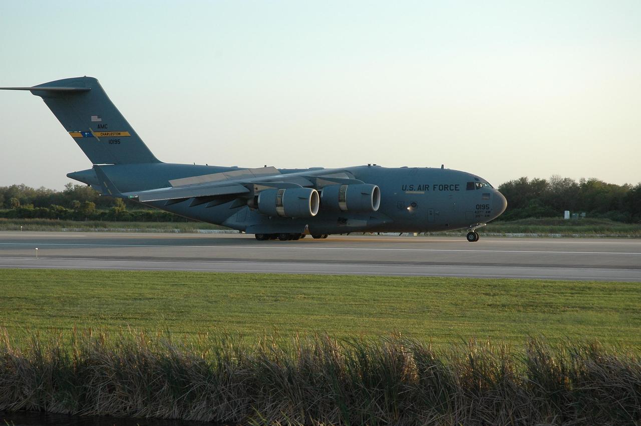 KENNEDY SPACE CENTER, FLA. --  This U.S. Air Force C-17 Globemaster III lands at the Kennedy Space Center's Shuttle Landing Facility carrying the Phoenix spacecraft. The Phoenix mission is the first project in NASA's first openly competed program of Mars Scout missions. Phoenix will land in icy soils near the north polar permanent ice cap of Mars and explore the history of the water in these soils and any associated rocks, while monitoring polar climate. Landing is planned in May 2008 on arctic ground where a mission currently in orbit, Mars Odyssey, has detected high concentrations of ice just beneath the top layer of soil. It will serve as NASA's first exploration of a potential modern habitat on Mars and open the door to a renewed search for carbon-bearing compounds, last attempted with NASA’s Viking missions in the 1970s. A stereo color camera and a weather station will study the surrounding environment while the other instruments check excavated soil samples for water, organic chemicals and conditions that could indicate whether the site was ever hospitable to life. Microscopes can reveal features as small as one one-thousandth the width of a human hair. Launch of Phoenix aboard a Delta II rocket is targeted for Aug. 3 from Cape Canaveral Air Force Station in Florida.  Photo credit: NASA/Charisse Nahser