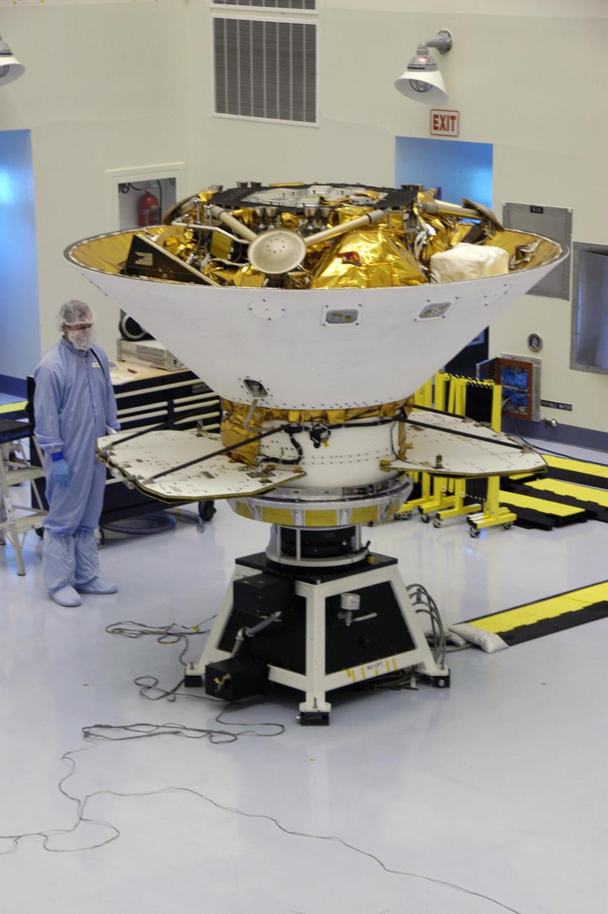 KENNEDY SPACE CENTER, FLA. -- Secured on the spin table, the backshell with the Phoenix Mars Lander inside is ready for spin testing in the Payload Hazardous Servicing Facility. The Phoenix mission is the first project in NASA's first openly competed program of Mars Scout missions. Phoenix will land in icy soils near the north polar permanent ice cap of Mars and explore the history of the water in these soils and any associated rocks, while monitoring polar climate. Landing is planned in May 2008 on arctic ground where a mission currently in orbit, Mars Odyssey, has detected high concentrations of ice just beneath the top layer of soil. It will serve as NASA's first exploration of a potential modern habitat on Mars and open the door to a renewed search for carbon-bearing compounds, last attempted with NASA’s Viking missions in the 1970s. A stereo color camera and a weather station will study the surrounding environment while the other instruments check excavated soil samples for water, organic chemicals and conditions that could indicate whether the site was ever hospitable to life. Microscopes can reveal features as small as one one-thousandth the width of a human hair. Launch of Phoenix aboard a Delta II rocket is targeted for Aug. 3 from Cape Canaveral Air Force Station in Florida.   Photo credit: NASA/George Shelton