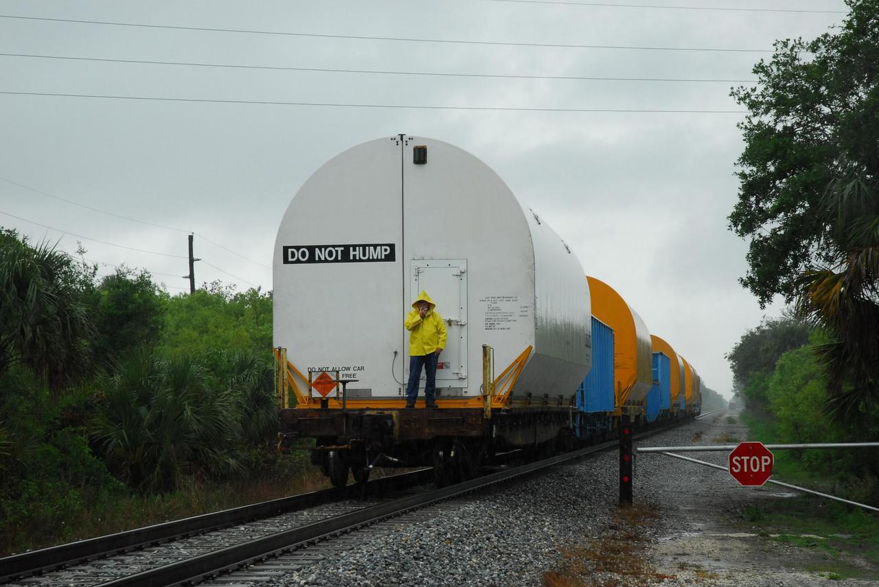 KENNEDY SPACE CENTER, FLA. --  Solid rocket motor segments and two aft exit cone segments arrive by rail at NASA's Kennedy Space Center.  While enroute, solid rocket motor segments were involved in a derailment in Alabama.  The rail cars carrying these segments remained upright and were undamaged.  An inspection determined these segment cars could continue on to Florida.  The segments themselves will undergo further evaluation at Kennedy before they are cleared for flight.  Other segments involved in the derailment will be returned to a plant in Utah for further evaluation.  Photo credit: NASA/George Shelton
