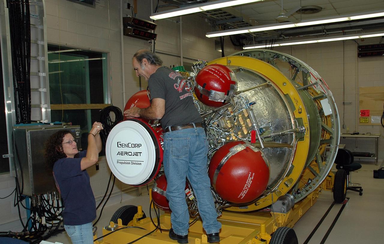 KENNEDY SPACE CENTER, FLA. --  In Hangar A&O at Cape Canaveral Air Force Station, United Launch Alliance workers prepare the Delta II second stage for the Phoenix spacecraft. Phoenix will land in icy soils near the north polar permanent ice cap of Mars and explore the history of the water in these soils and any associated rocks, while monitoring polar climate.  Landing is planned in May 2008 on arctic ground where a mission currently in orbit, Mars Odyssey, has detected high concentrations of ice just beneath the top layer of soil. Launch of Phoenix aboard a Delta II rocket is targeted for Aug. 3 from Cape Canaveral Air Force Station in Florida.   Photo credit: NASA/Jack Pfaller