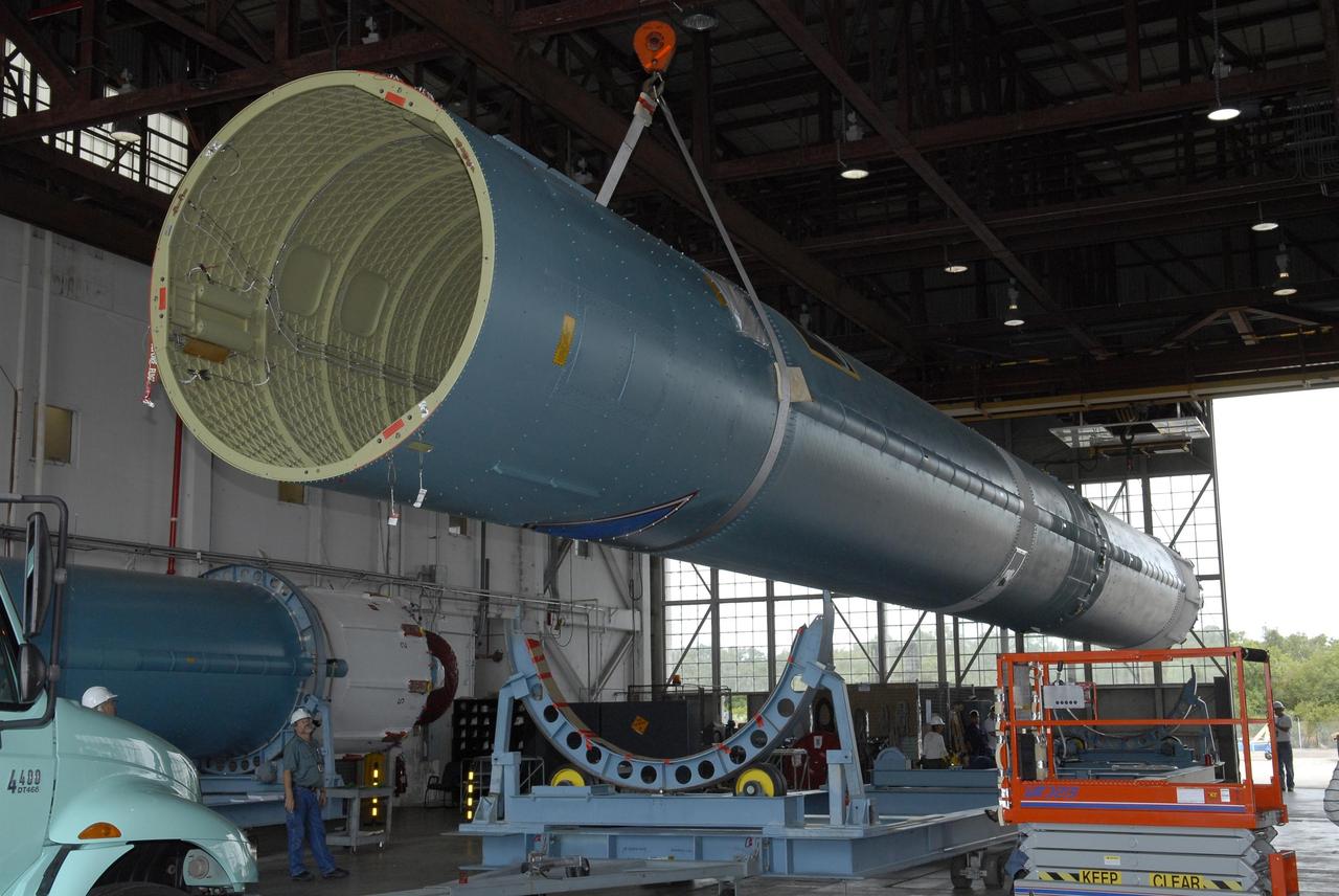 KENNEDY SPACE CENTER, FLA. --   Inside the Hangar M on Cape Canaveral Air Force Station, another Delta II first stage is lifted from its stand to be placed on a transporter. The Delta will be moved to the launch pad for the future launch of a Global Positioning Satellite. Photo credit: NASA/Kim Shiflett