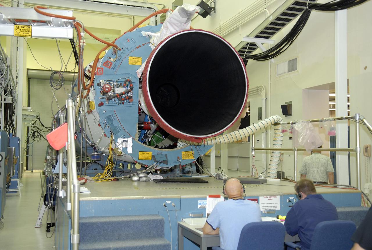 KENNEDY SPACE CENTER, FLA. -- In Hangar A&O on Cape Canaveral Air Force Station in Florida, workers conduct a steering test on the first stage of a Delta II rocket. The rocket is designated for the launch of the Phoenix Mars Lander spacecraft. Phoenix will land in icy soils near the north polar permanent ice cap of Mars and explore the history of the water in these soils and any associated rocks, while monitoring polar climate. Landing is planned in May 2008 on arctic ground where a mission currently in orbit, Mars Odyssey, has detected high concentrations of ice just beneath the top layer of soil. Launch of Phoenix is targeted for Aug. 3. Photo credit: NASA/Kim Shiflett