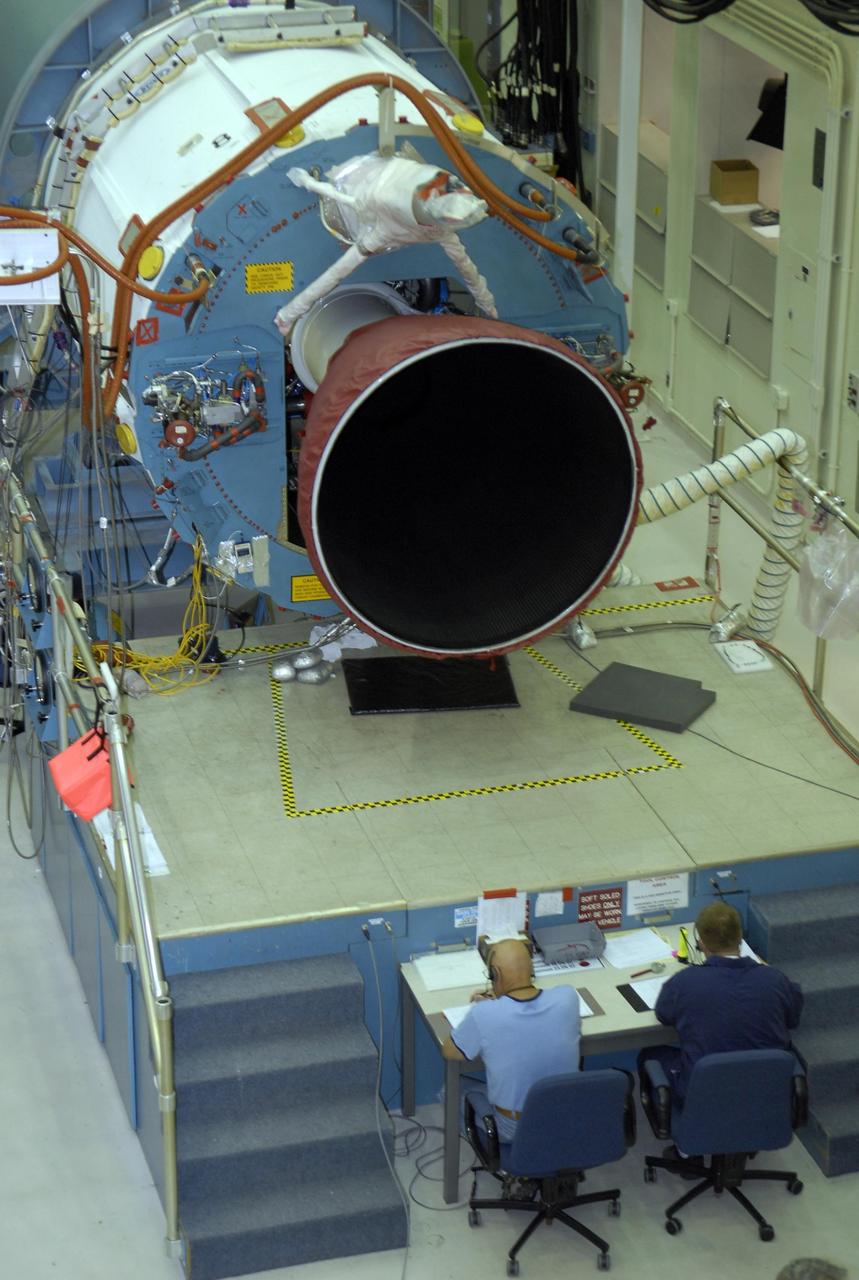KENNEDY SPACE CENTER, FLA. -- In Hangar A&O on Cape Canaveral Air Force Station in Florida, workers conduct a steering test on the first stage of a Delta II rocket. The rocket is designated for the launch of the Phoenix Mars Lander spacecraft. Phoenix will land in icy soils near the north polar permanent ice cap of Mars and explore the history of the water in these soils and any associated rocks, while monitoring polar climate. Landing is planned in May 2008 on arctic ground where a mission currently in orbit, Mars Odyssey, has detected high concentrations of ice just beneath the top layer of soil. Launch of Phoenix is targeted for Aug. 3. Photo credit: NASA/Kim Shiflett