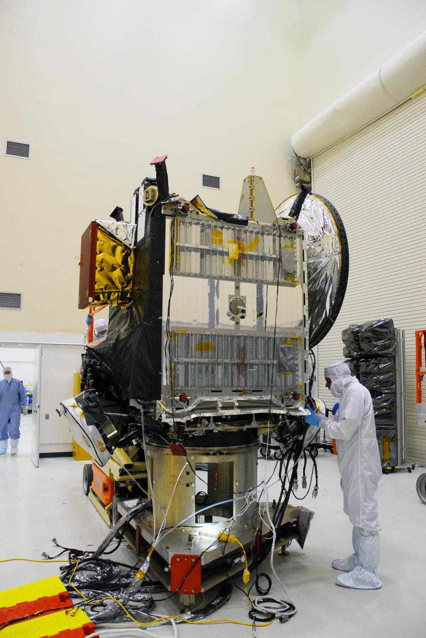 KENNEDY SPACE CENTER, FLA. -- In a clean room at Astrotech, workers prepare the Dawn spacecraft for thermal blanket installation. Dawn's mission is to explore two of the asteroid belt's most intriguing and dissimilar occupants: asteroid Vesta and the dwarf planet Ceres. Dawn is scheduled to launch June 30 from Launch Complex 17-B. Photo credit: NASA/George Shelton