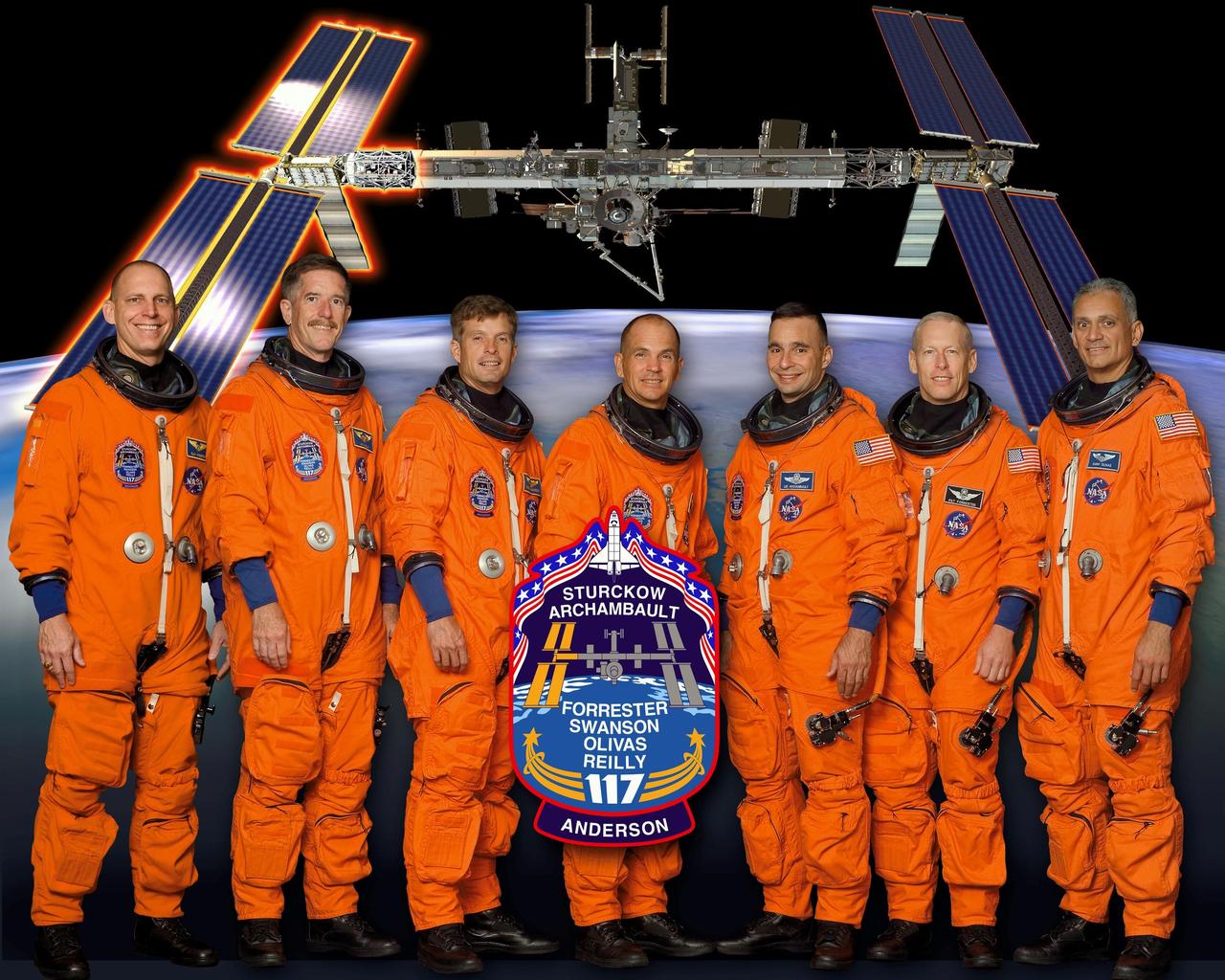 KENNEDY SPACE CENTER, FLA. -- STS117-S-002 (May 2007) --- These seven astronauts take a break from training to pose for the STS-117 crew portrait. Scheduled to launch aboard the Space Shuttle Atlantis are (from the left) astronauts Clayton C. Anderson, James F. Reilly II, Steven R. Swanson, mission specialists; Frederick W. (Rick) Sturckow, commander; Lee J. Archambault, pilot; Patrick G. Forrester and John D. (Danny) Olivas, mission specialists. Anderson will join Expedition 15 in progress to serve as a flight engineer aboard the International Space Station. The crewmembers are attired in training versions of their shuttle launch and entry suits.