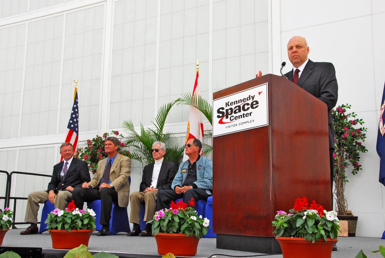 KENNEDY SPACE CENTER, FLA. --     NASA, Kennedy Space Center and State of Florida dignitaries helped launch the opening of the newest attraction at Kennedy Space Center's Visitor Complex, the Shuttle Launch Experience.  At the dais is Dan LeBlanc, chief operating officer of the KSC Visitor Complex. Seated on stage are (from left) Lt. Governor of Florida Jeff Kottkamp, Center Director Bill Parsons, and former astronauts John Young and Bob Crippen. The attraction includes a simulated launch with the sights, sounds and sensations of launching into space. Find out more about the Visitor Complex and the Shuttle Launch Experience at <b>http://www.kennedyspacecenter.com/visitKSC/attractions/index.asp</b>.  Photo credit: NASA/George Shelton