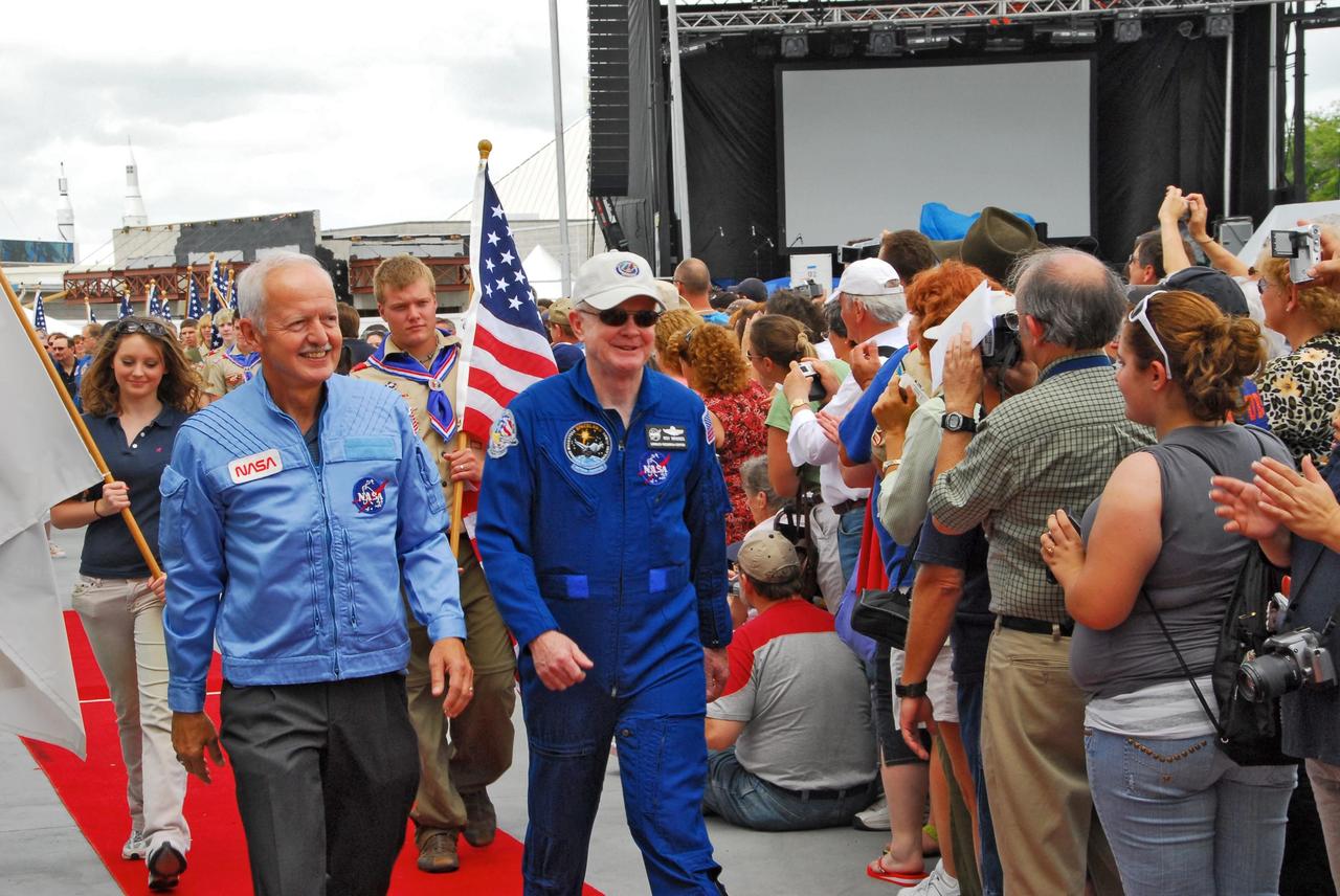 KENNEDY SPACE CENTER, FLA. --   NASA, Kennedy Space Center and State of Florida dignitaries helped launch the opening of the newest attraction at Kennedy Space Center's Visitor Complex, the Shuttle Launch Experience.  Walking through the crowd is former astronaut Roy Bridges, who also is a former center director of KSC. The attraction includes a simulated launch with the sights, sounds and sensations of launching into space. Find out more about the Visitor Complex and the Shuttle Launch Experience at <b>http://www.kennedyspacecenter.com/visitKSC/attractions/index.asp</b>.  Photo credit: NASA/George Shelton