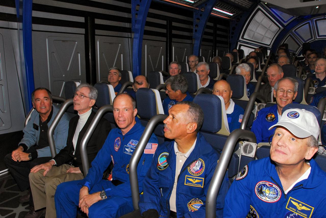 KENNEDY SPACE CENTER, FLA. -- Former astronauts take their seats in the newest attraction at Kennedy Space Center's Visitor Complex, the Shuttle Launch Experience. In the front row are (from left) Bob Crippen, John Young, Rick Searfoss, Charles Bolden and Norm Thagard. The attraction includes a simulated launch with the sights, sounds and sensations of launching into space. Find out more about the Visitor Complex and the Shuttle Launch Experience at <b>http://www.kennedyspacecenter.com/visitKSC/attractions/index.asp</b>. Photo credit: NASA/George Shelton