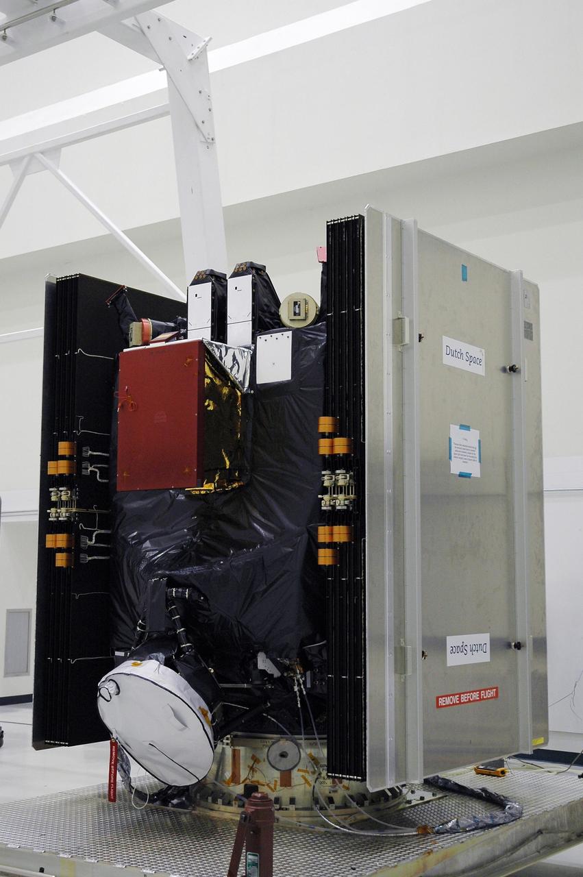 KENNEDY SPACE CENTER, FLA. -- At Astrotech's Payload Processing Facility, the solar panels on the Dawn spacecraft are stowed in preparation for Dawn's transfer to a transporter and move to the Hazardous Processing Facility for fueling.  Dawn is scheduled to launch June 30 aboard a Delta II rocket from Launch Complex 17-B at Cape Canaveral Air Force Station.  Dawn's mission is to explore two of the asteroid belt's most intriguing and dissimilar occupants: asteroid Vesta and the dwarf planet Ceres. Photo credit: NASA/Charisse Nahser