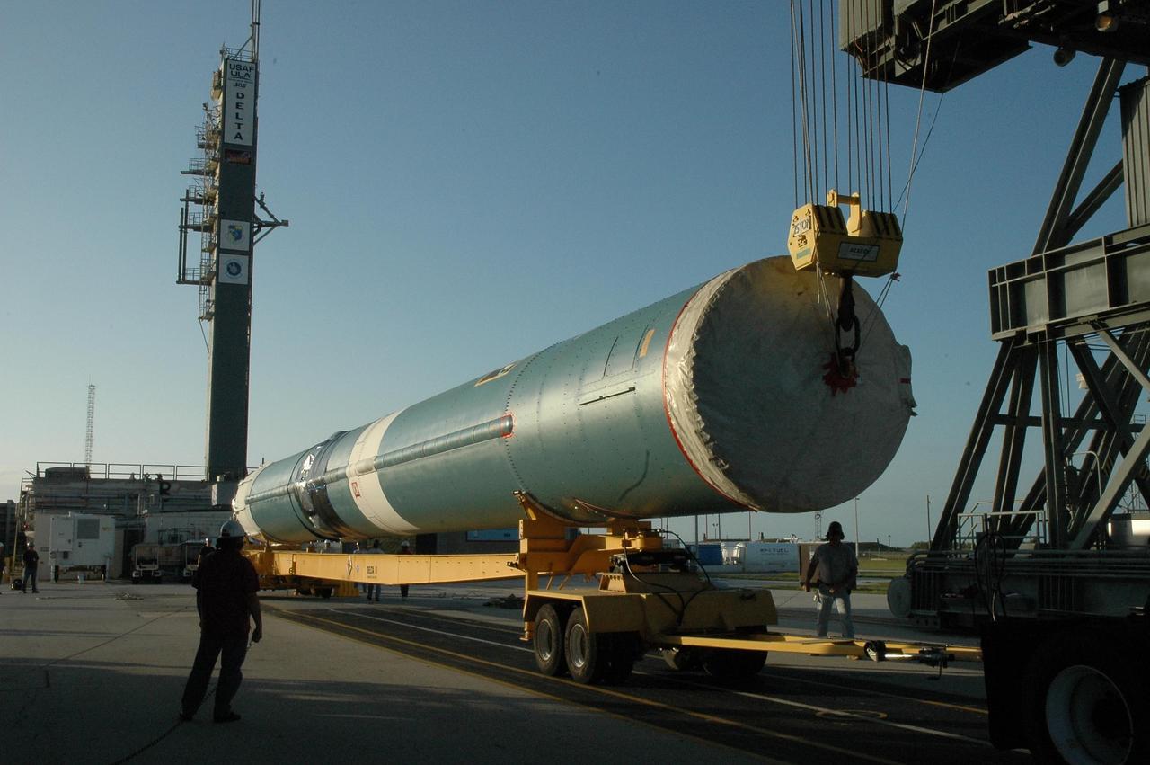 KENNEDY SPACE CENTER, FLA. --  On Launch Pad 17-B at Cape Canaveral Air Force Station, the first stage of a Delta II rocket is ready for raising to a vertical position.  Once vertical, the rocket will be lifted up into the mobile service tower.  The rocket is the launch vehicle for the Dawn spacecraft, targeted for liftoff on June 30. Dawn's mission is to explore two of the asteroid belt's most intriguing and dissimilar occupants: asteroid Vesta and the dwarf planet Ceres.   Photo credit: NASA/Amanda Diller