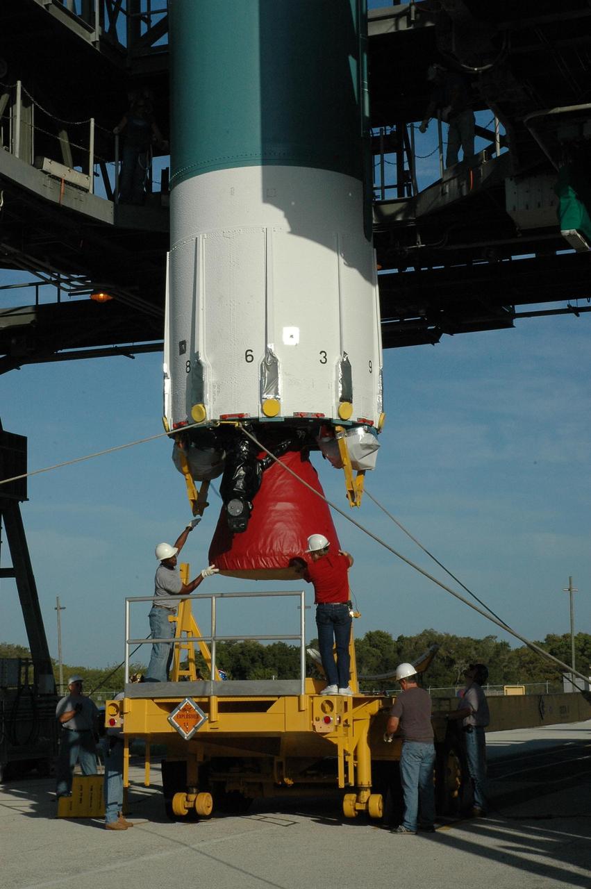 KENNEDY SPACE CENTER, FLA. --  On Launch Pad 17-B at Cape Canaveral Air Force Station, the first stage of a Delta II rocket is checked before it is lifted into the mobile service tower. The rocket is the launch vehicle for the Dawn spacecraft, targeted for liftoff on June 30.  Dawn's mission is to explore two of the asteroid belt's most intriguing and dissimilar occupants: asteroid Vesta and the dwarf planet Ceres.   Photo credit: NASA/Amanda Diller