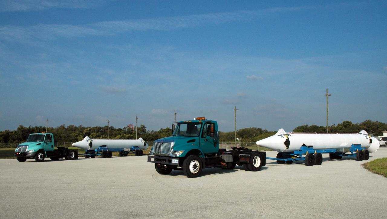 KENNEDY SPACE CENTER, FLA. --  Solid rocket boosters arrive on Launch Pad 17-B at Cape Canaveral Air Force Station to be mated to the Delta II rocket waiting there.  The rocket is the launch vehicle for the Dawn spacecraft, scheduled to launch June 30.  Dawn's mission is to explore two of the asteroid belt's most intriguing and dissimilar occupants: asteroid Vesta and the dwarf planet Ceres.  Photo credit: NASA/Jim Grossmann