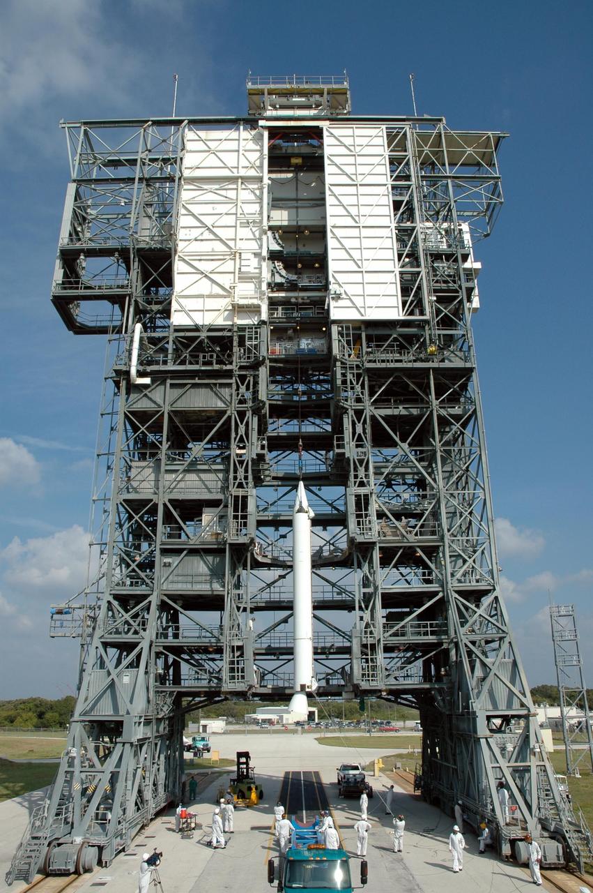 KENNEDY SPACE CENTER, FLA. -- On Launch Pad 17-B at Cape Canaveral Air Force Station, one of nine solid rocket boosters is lifted into the mobile service tower. It will be attached to the Delta II first stage for the launch of the Dawn spacecraft. Dawn's mission is to explore two of the asteroid belt's most intriguing and dissimilar occupants: asteroid Vesta and the dwarf planet Ceres. Photo credit: NASA/Jim Grossmann