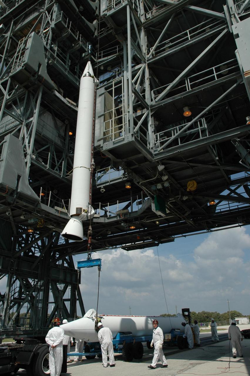 KENNEDY SPACE CENTER, FLA. -- On Launch Pad 17-B at Cape Canaveral Air Force Station, a second solid rocket booster arrives under the mobile service tower. It will join the first, seen above, and be attached to the Delta II first stage for the launch of the Dawn spacecraft. Dawn's mission is to explore two of the asteroid belt's most intriguing and dissimilar occupants: asteroid Vesta and the dwarf planet Ceres. Photo credit: NASA/Jim Grossmann