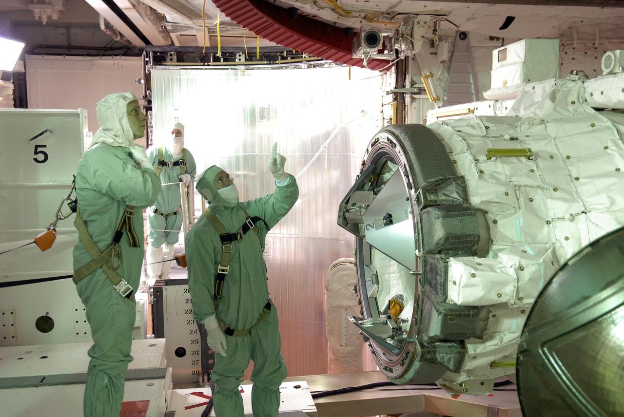 KENNEDY SPACE CENTER, FLA. -- After their arrival at KSC, STS-117 crew members take part in a payload bay walkdown on Launch Pad 39A to look at the cargo in Space Shuttle Atlantis.  Seen here are Mission Specialists Patrick Forrester (left) and James Reilly.  The payload includes the S3/S4 integrated truss structure for the International Space Station. The payload includes the S3/S4 integrated truss structure for the International Space Station.  STS-117 is scheduled to launch at 7:38 p.m. June 8.  During the 11-day mission and three spacewalks, the crew will work with flight controllers at NASA's Johnson Space Center in Houston to install the 17-ton segment on the station's girder-like truss and deploy the set of solar arrays, S3/S4. The mission will increase the space station's power capability in preparation for the arrival of new science modules from the European and Japanese space agencies.    Photo credit: NASA/Kim Shiflett
