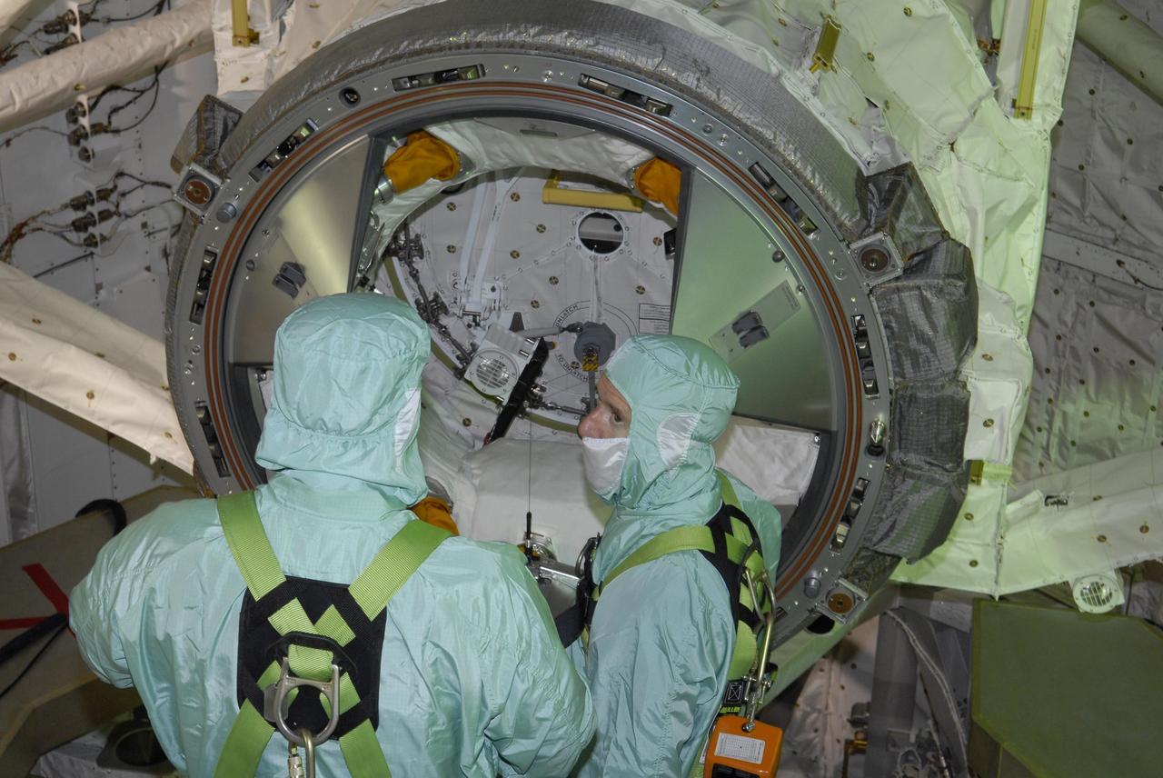 KENNEDY SPACE CENTER, FLA. --  After their arrival at KSC, STS-117 crew members take part in a payload bay walkdown on Launch Pad 39A to look at the cargo in Space Shuttle Atlantis. The payload includes the S3/S4 integrated truss structure for the International Space Station. STS-117 is scheduled to launch at 7:38 p.m. June 8.  During the 11-day mission and three spacewalks, the crew will work with flight controllers at NASA's Johnson Space Center in Houston to install the 17-ton segment on the station's girder-like truss and deploy the set of solar arrays, S3/S4. The mission will increase the space station's power capability in preparation for the arrival of new science modules from the European and Japanese space agencies.    Photo credit: NASA/Kim Shiflett