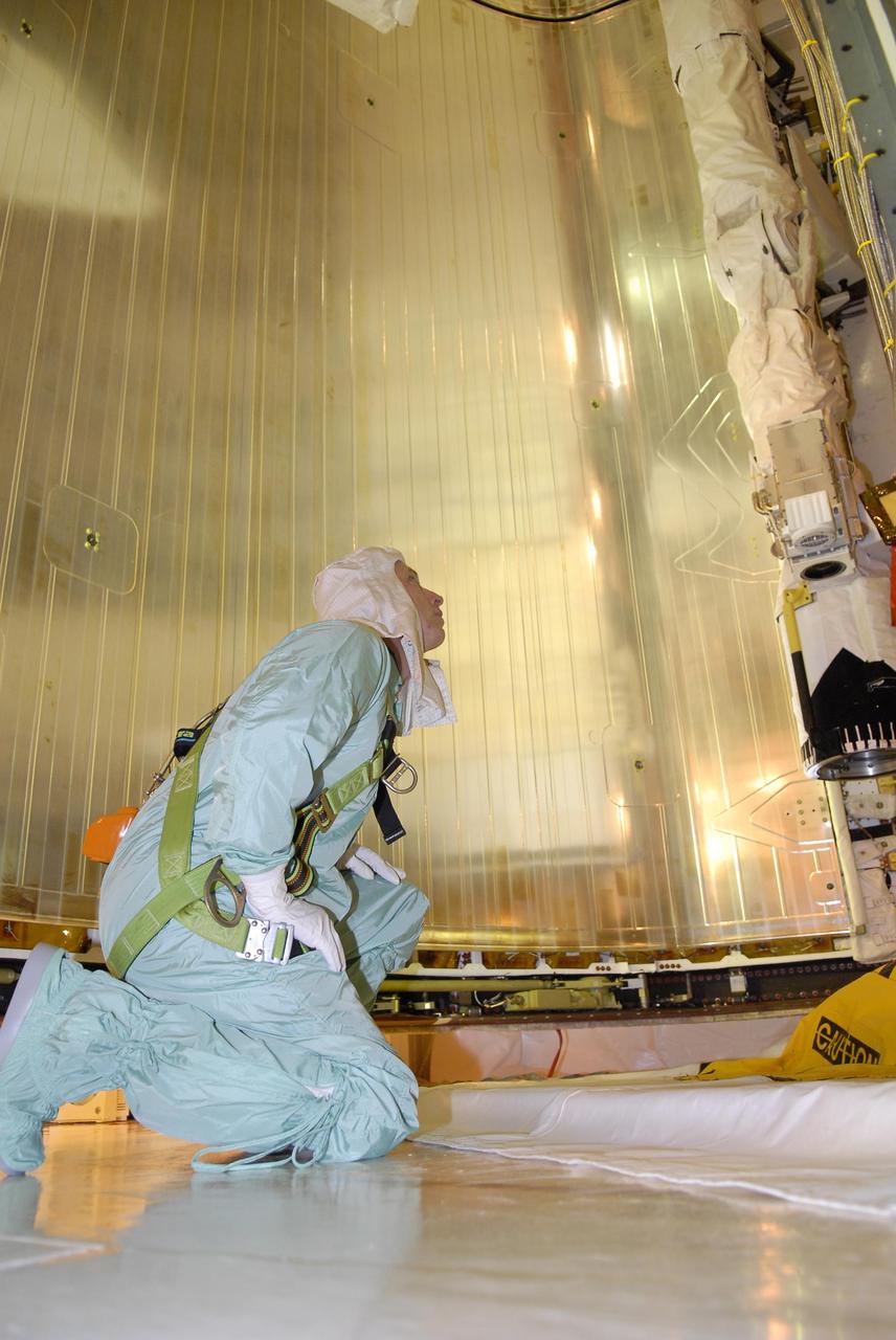 KENNEDY SPACE CENTER, FLA. --   After their arrival at KSC, STS-117 crew members take part in a payload bay walkdown on Launch Pad 39A to look at the cargo in Space Shuttle Atlantis.  Seen here is Mission Specialist Patrick Forrester.  The payload includes the S3/S4 integrated truss structure for the International Space Station.  STS-117 is scheduled to launch at 7:38 p.m. June 8.  During the 11-day mission and three spacewalks, the crew will work with flight controllers at NASA's Johnson Space Center in Houston to install the 17-ton segment on the station's girder-like truss and deploy the set of solar arrays, S3/S4. The mission will increase the space station's power capability in preparation for the arrival of new science modules from the European and Japanese space agencies.    Photo credit: NASA/Kim Shiflett