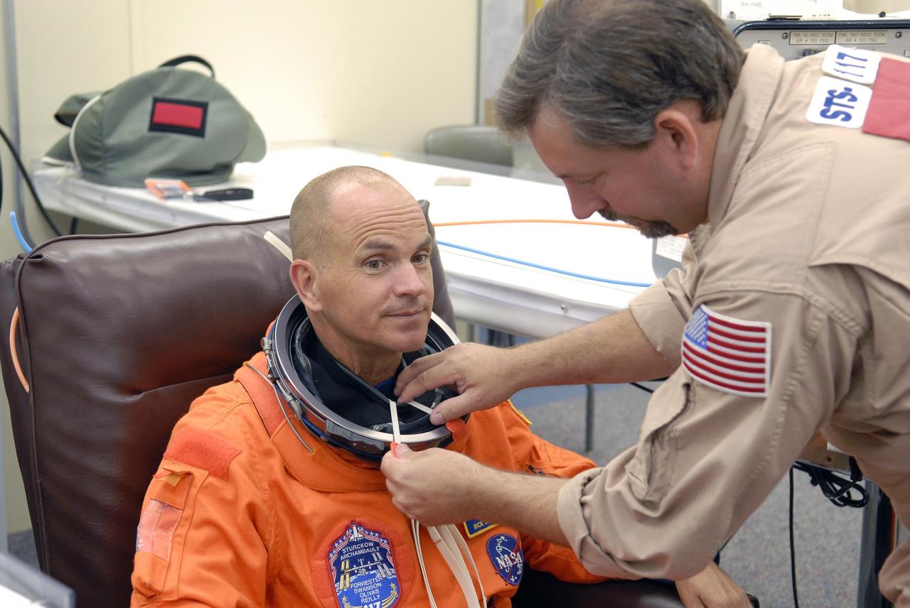 KENNEDY SPACE CENTER, FLA. --   In the Operations and Checkout Building, the crew members of mission STS-117 are suiting up for a launch attempt at 7:38 p.m. EDT from Launch Pad 39A aboard Space Shuttle Atlantis. Pictured here is Commander Frederick Sturckow, who is making his third shuttle flight. The shuttle is delivering a new segment to the starboard side of the International Space Station's backbone, known as the truss. Three spacewalks are planned to install the S3/S4 truss segment, deploy a set of solar arrays and prepare them for operation. STS-117 is the 118th space shuttle flight, the 21st flight to the station, the 28th flight for Atlantis and the first of four flights planned for 2007.    Photo credit: NASA/Kim Shiflett