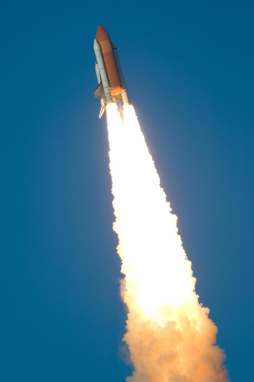 KENNEDY SPACE CENTER, FLA. --  Twin columns of fire rocket the Space Shuttle Atlantis into the sky above Kennedy Space Center.  Liftoff of Atlantis on mission STS-117 to the International Space Station from Launch Pad 39A was on-time at 7:38:04 p.m. EDT. The shuttle is delivering a new segment to the starboard side of the International Space Station's backbone, known as the truss. Three spacewalks are planned to install the S3/S4 truss segment, deploy a set of solar arrays and prepare them for operation. STS-117 is the 118th space shuttle flight, the 21st flight to the station, the 28th flight for Atlantis and the first of four flights planned for 2007.   Photo credit: NASA/Chris Lynch