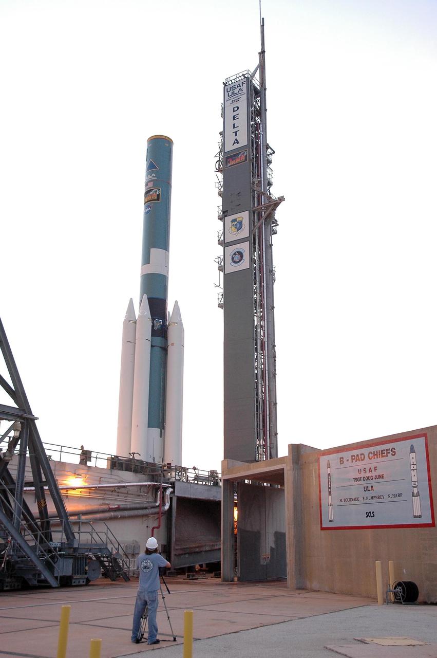 KENNEDY SPACE CENTER, FLA. -- On Launch Pad 17-B at Cape Canaveral Air Force Station, the Delta II first stage waits for the mating of additional solid rocket boosters for launch of the Dawn spacecraft.  Dawn's goal is to characterize the conditions and processes of the solar system's earliest epoch 4.5 billion years ago by investigating in detail two of the largest asteroids, Ceres and Vesta. They reside between Mars and Jupiter in the asteroid belt.  Launch is targeted for July 7.  Photo credit: NASA/Jim Grossmann